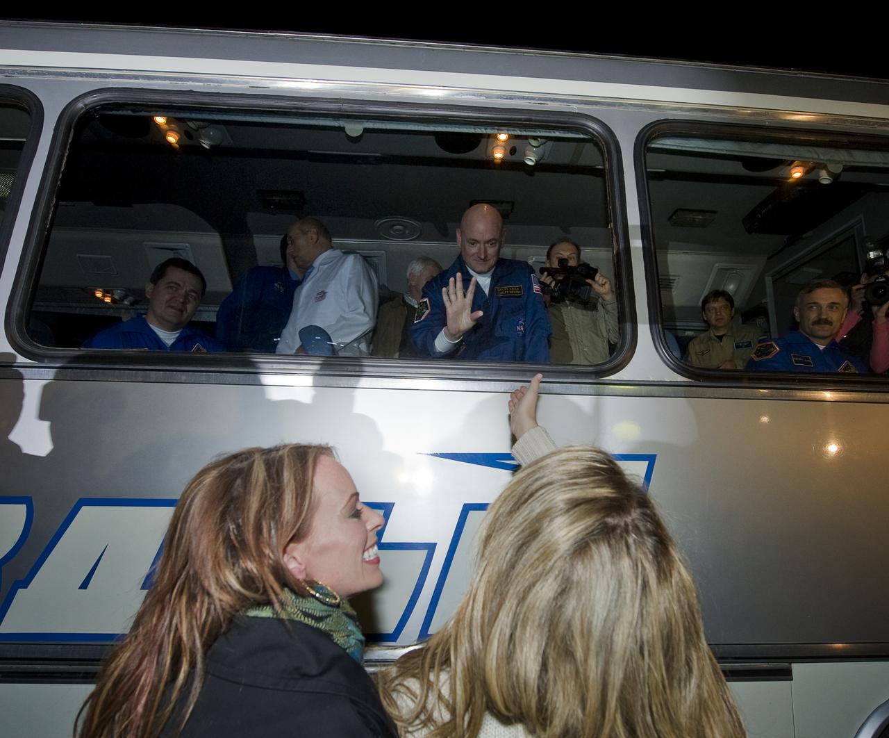 Expedition 25 NASA Flight Engineer Scott Kelly waves farewell to friends and family as he and his crew mates depart the Cosmonaut Hotel on the evening before their launch at the Cosmonaut Hotel, Thursday, Oct. 7, 2010 in Baikonur, Kazakhstan. Photo Credit: (NASA/Carla Cioffi)