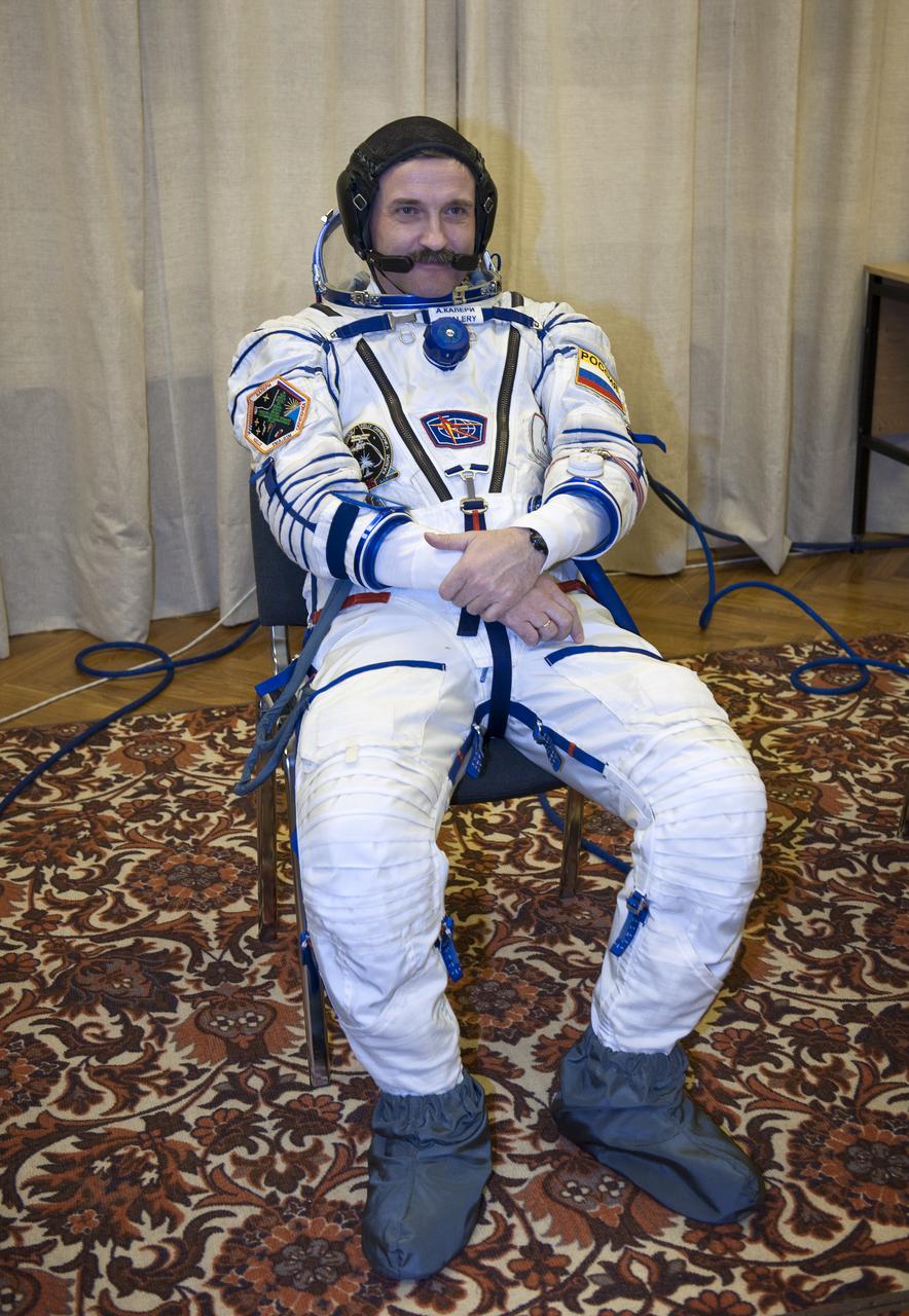Expedition 25 Soyuz Commander Alexander Kaleri awaits to have his Russian Sokol Suit pressure checked at the Baikonur Cosmodrome on Friday, Oct. 8, 2010 in Baikonur, Kazakhstan.  Kaleri and fellow Expedition 25 crew members Flight Engineers Scott Kelly and Oleg Skripochka launched in their Soyuz TMA-01M at 5:10 a.m. Friday morning. (Photo Credit: NASA/Carla Cioffi)