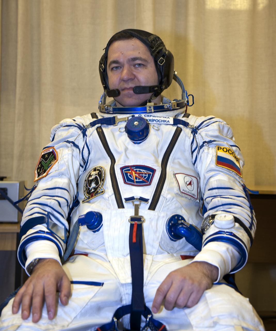 Expedition 25 Flight Engineer Oleg Skripochka awaits to have his Russian Sokol Suit pressure checked at the Baikonur Cosmodrome on Friday, Oct. 8, 2010 in Kazakhstan.  Skripochka, Soyuz Commander Alexander Kaleri and NASA Flight Engineer Scott Kelly launched in their Soyuz TMA-01M at 5:10 a.m. Friday morning. (Photo Credit: NASA/Carla Cioffi)