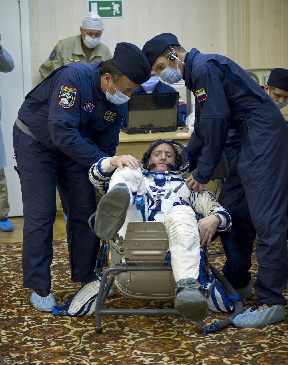 Expedition 25 NASA Flight Engineer Scott Kelly has his Russian Sokol Suit pressure checked at the Baikonur Cosmodrome in Kazakhstan on Friday, Oct. 8, 2010. (Photo Credit: NASA/Carla Cioffi)
