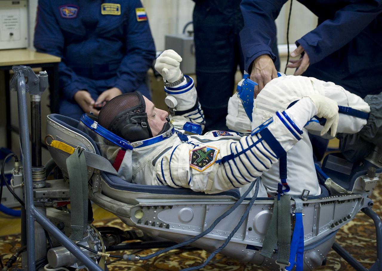 Expedition 25 NASA Flight Engineer Scott Kelly has his Russian Sokol Suit pressure checked at the Baikonur Cosmodrome in Kazakhstan on Friday, Oct. 8, 2010. (Photo Credit: NASA/Carla Cioffi)