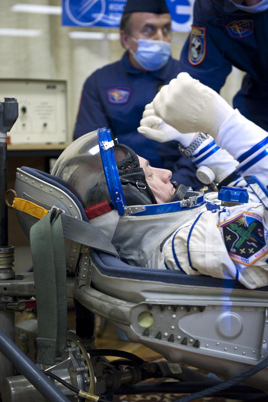 Expedition 25 NASA Flight Engineer Scott Kelly has his Russian Sokol Suit pressure checked at the Baikonur Cosmodrome in Kazakhstan on Friday, Oct. 8, 2010. (Photo Credit: NASA/Carla Cioffi)