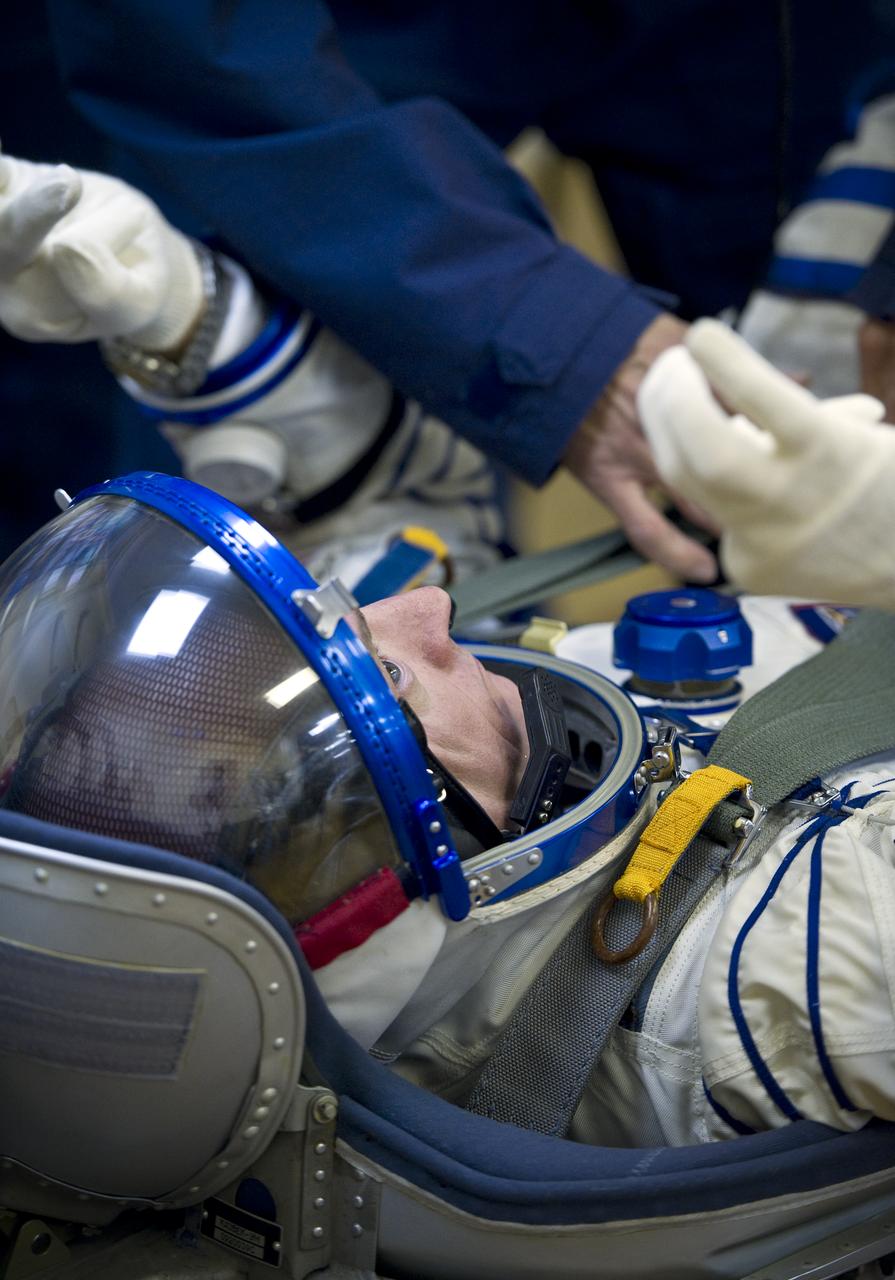 Expedition 25 NASA Flight Engineer Scott Kelly has his Russian Sokol Suit pressure checked at the Baikonur Cosmodrome in Kazakhstan on Friday, Oct. 8, 2010. (Photo Credit: NASA/Carla Cioffi)