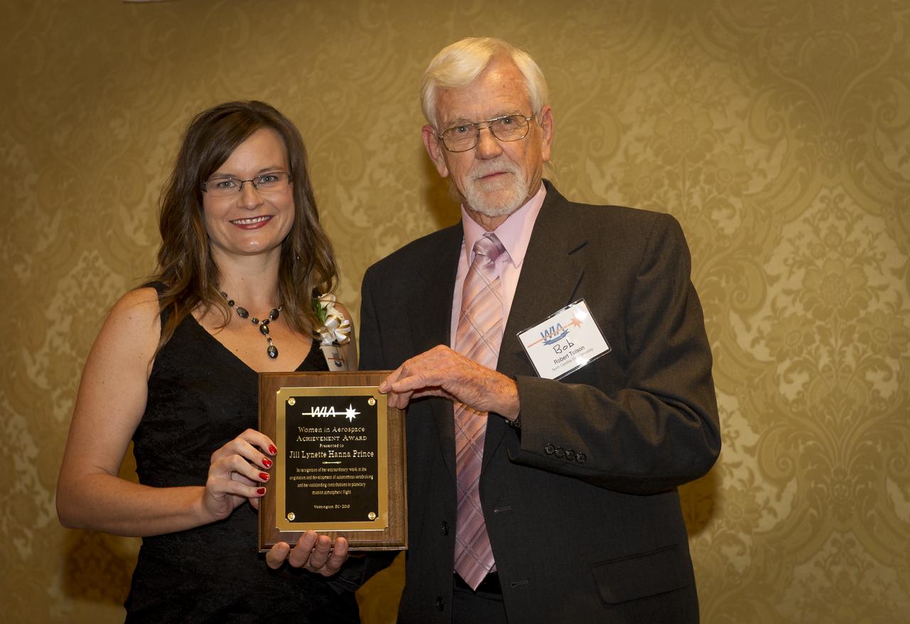 NASA Langley Aerospace Engineer Jill Lynette Hanna Prince receives the Women in Aerospace Achievement in Aerospace award from North Carolina State Professor Robert Tolson during the Women in Aerospace organization's annual awards ceremony and banquet held at the Ritz-Carlton Hotel in Arlington, VA on Tuesday, Oct. 26, 2010.  Four current NASA leaders and one retiree were recognized for their work by Women in Aerospace. The event celebrates women's professional excellence in aerospace and honors women who have made outstanding contributions to the aerospace community. Photo Credit: (NASA/Bill Ingalls)