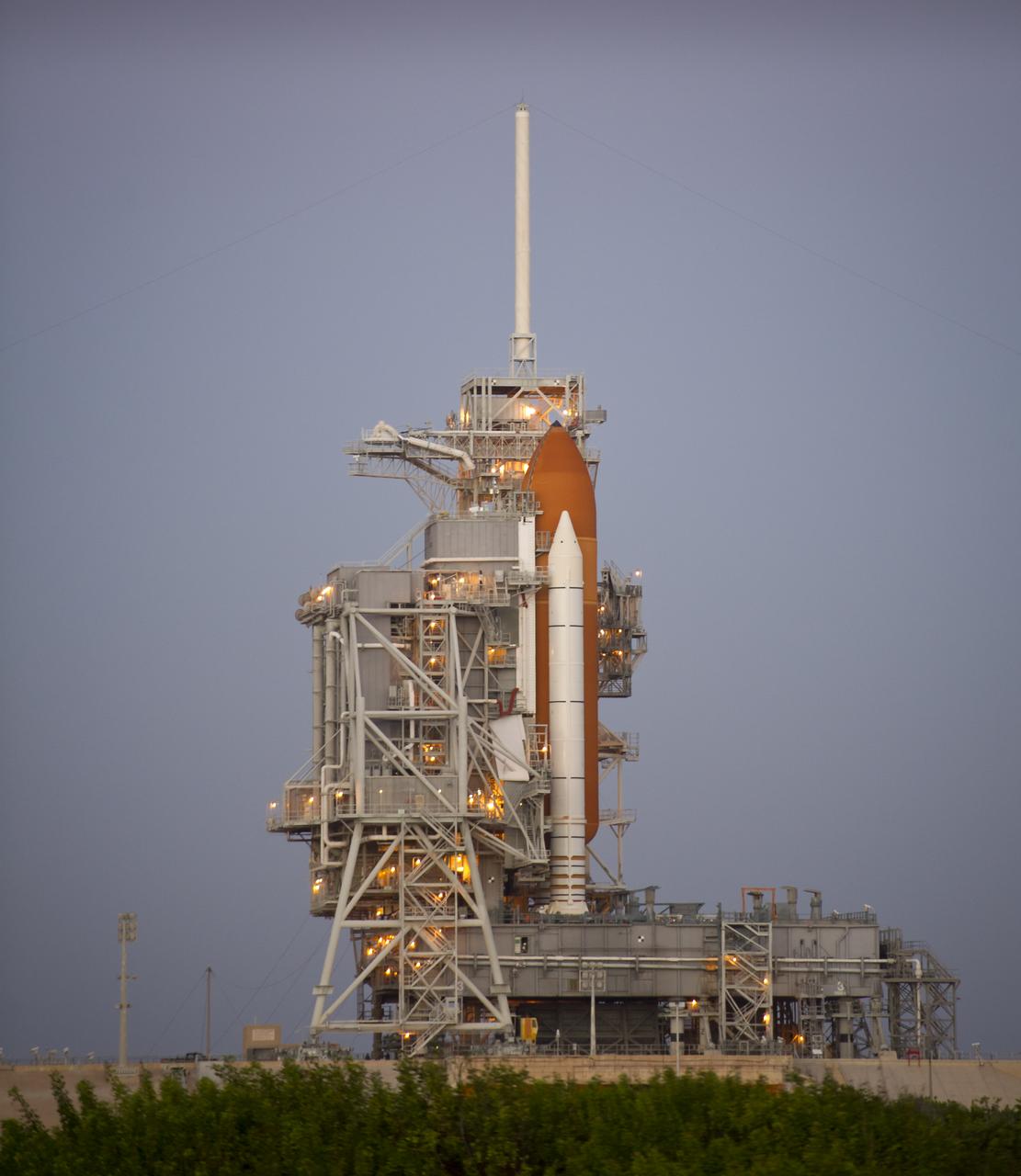 The space shuttle Discovery is seen on launch pad 39a early in the morning of Sunday, Oct. 31, 2010 at the NASA Kennedy Space Center in Cape Canaveral, Fla.  During Space Shuttle Discovery's final spaceflight, the STS-133 crew members will take important spare parts to the International Space Station along with the Express Logistics Carrier-4.  Discovery is targeted for launch at 3:52 p.m. Wednesday, Nov. 3, 2010.  Photo Credit: (NASA/Bill Ingalls)