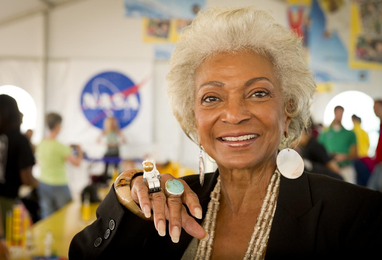 Actress Nichelle Nichols, known for her most famous role as communications officer Lieutenant Uhura aboard the USS Enterprise in the popular Star Trek television series, displays her Lego astronaut ring while visiting the “Build the Future” activity where students created their vision of the future in space with LEGO bricks and elements inside a tent that was set up on the launch viewing area at NASA's Kennedy Space Center in Cape Canaveral, Fla. on Monday, Nov. 1, 2010.  NASA and The LEGO Group signed a Space Act Agreement to spark children's interest in science, technology, engineering and math (STEM). Photo Credit: (NASA/Bill Ingalls)