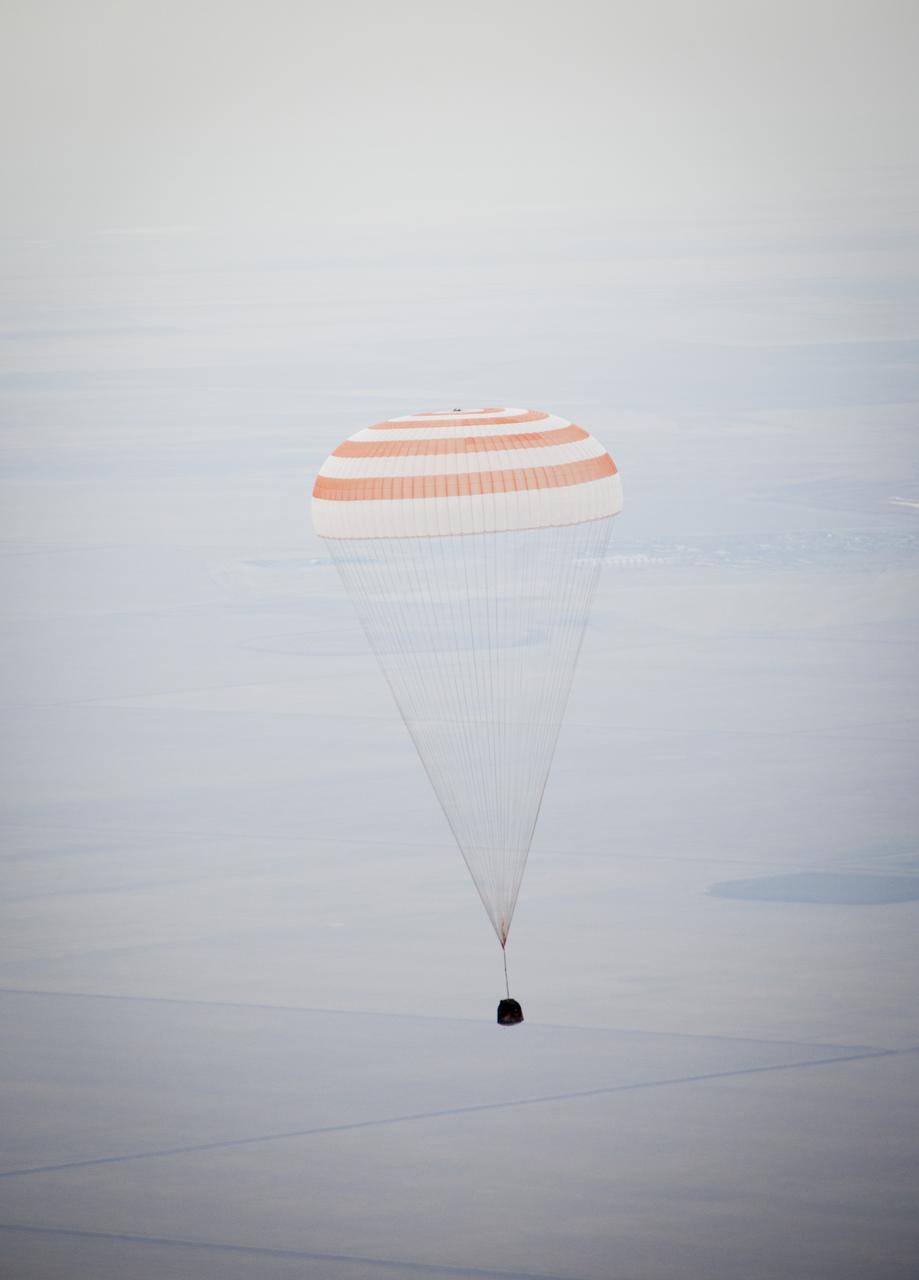 The Soyuz TMA-19 spacecraft is seen as it descends with Expedition 25 Commander Doug Wheelock and Flight Engineers Shannon Walker and Fyodor Yurchikhin near the town of Arkalyk, Kazakhstan on Friday, Nov. 26, 2010. Russian Cosmonaut Yurchikhin and NASA Astronauts Wheelock and Walker, are returning from nearly six months onboard the International Space Station where they served as members of the Expedition 24 and 25 crews. Photo Credit: (NASA/Bill Ingalls)