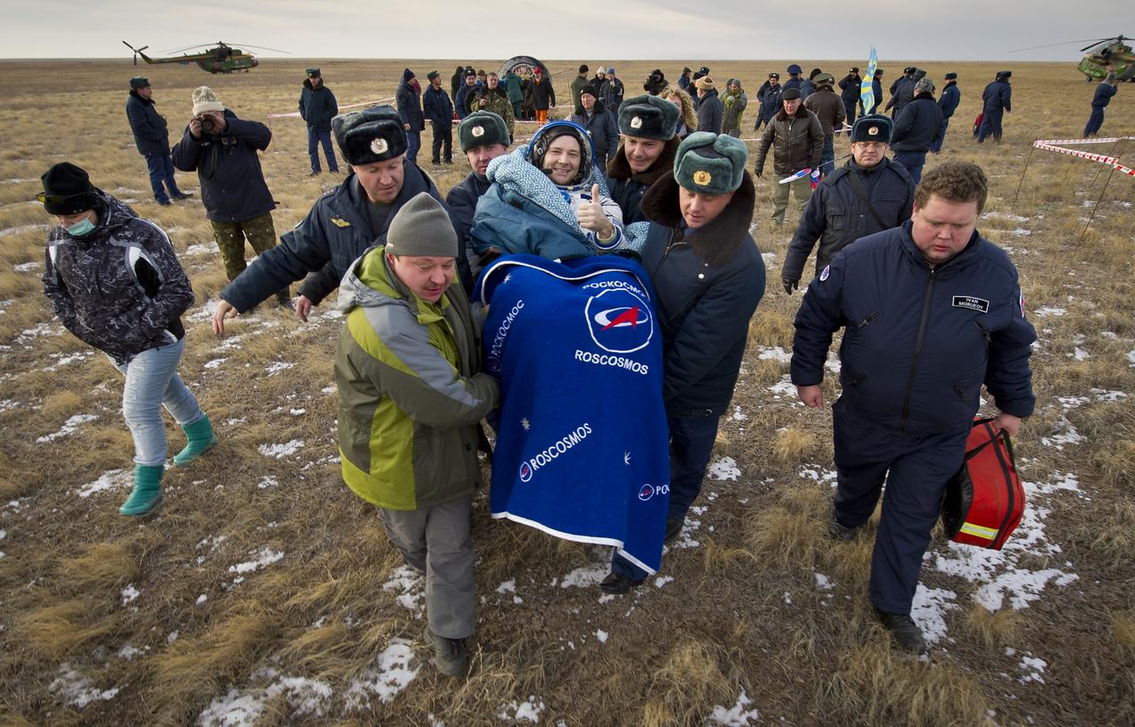 Expedition 25 Commander Doug Wheelock is carried to a nearby medical tent following the landing of the Soyuz TMA-19 spacecraft near the town of Arkalyk, Kazakhstan on Friday, Nov. 26, 2010. Russian Cosmonaut Fyodor Yurchikhin and NASA Astronauts Wheelock and Shannon Walker, returned from nearly six months onboard the International Space Station where they served as members of the Expedition 24 and 25 crews. Photo Credit: (NASA/Bill Ingalls)