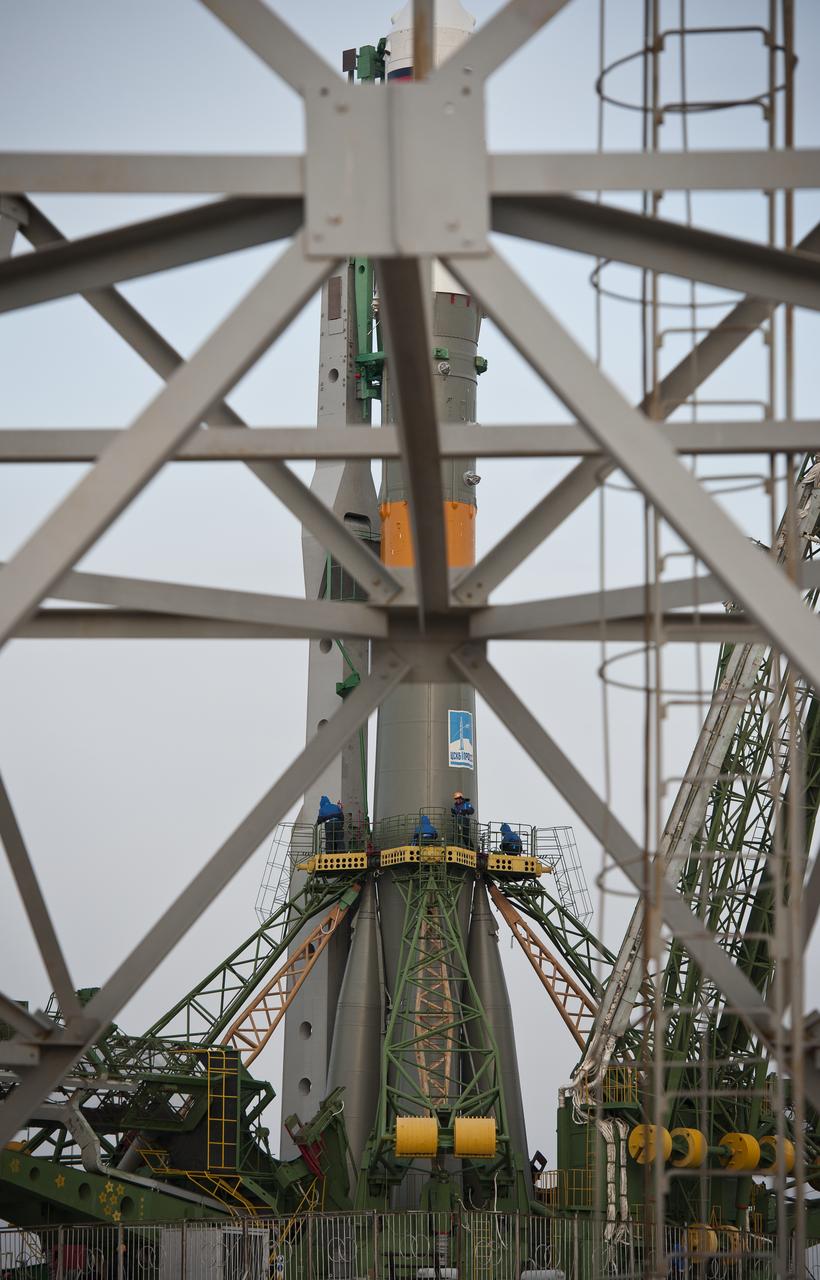 Launch pad engineers are seen as they begin final prelaunch preparations on the Soyuz TMA-20 spacecraft after its rollout to the launch pad at the Baikonur Cosmodrome on Monday, Dec. 13, 2010 in Kazakhstan.  The launch of the Soyuz spacecraft with Expedition 26 Soyuz Commander Dmitry Kondratyev, NASA Flight Engineer Catherine Coleman, and Italian astronaut Paolo Nespoli is scheduled for Thursday, Dec., 16, 2010 at 1:09 a.m. local time.  Photo Credit:  (NASA/Carla Cioffi)