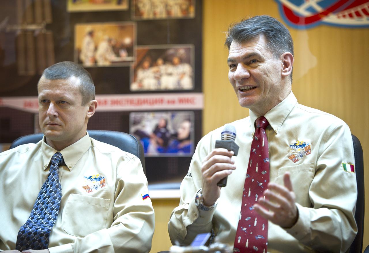 Expedition 26 Flight Engineer Paolo Nespoli, right, speaks as Expedition 26 Soyuz Commander Dmitry Kondratyev, looks on at the State Commission press conference held at the Cosmonaut Hotel in Baikonur, Kazakhstan on Tuesday, Dec. 14, 2010. Photo Credit: (NASA/Carla Cioffi)