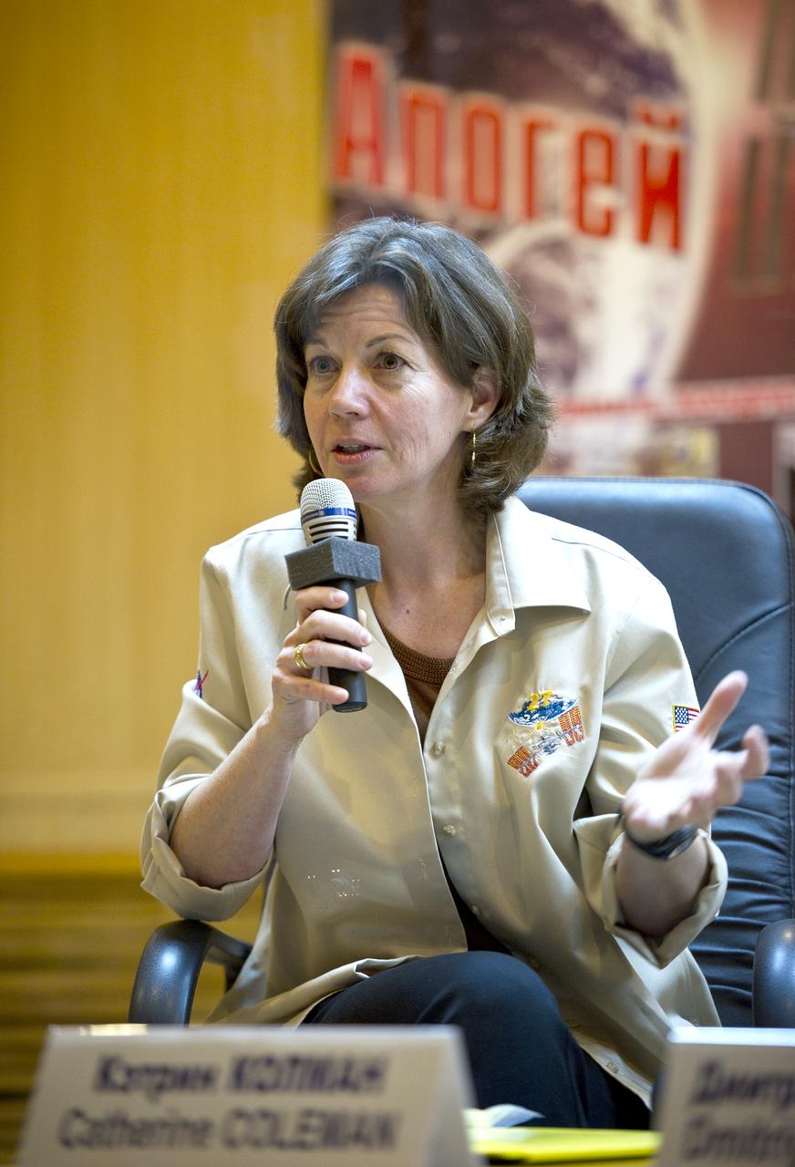 Expedition 26 Flight Engineer Catherine Coleman is seen talking at the State Commission press conference held at the Cosmonaut Hotel in Baikonur, Kazakhstan on Tuesday, Dec. 14, 2010. Photo Credit: (NASA/Carla Cioffi)