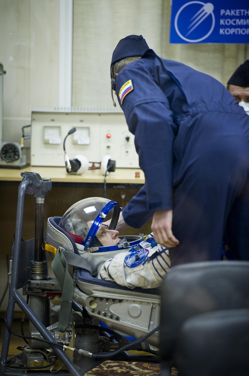 Expedition 26 Soyuz Commander Dmitry Kondratyev has his Russian Sokol suit pressure checked at the Baikonur Cosmodrome in Baikonur, Kazakhstan, Wednesday, Dec. 15, 2010. Kondratyev and fellow Expedition 26 crew members NASA Flight Engineer Catherine Coleman and European Space Agency astronaut Paolo Nespoli launched in their Soyuz TMA-20 rocket from the Baikonur Cosmodrome in Kazakhstan the following morning at 1:09 a.m. local time. (Photo Credit: NASA/Carla Cioffi)