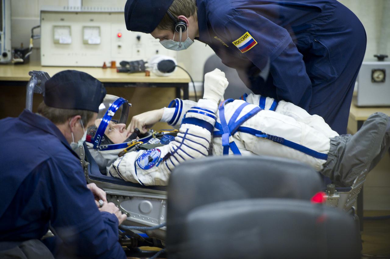 Expedition 26 Soyuz Commander Dmitry Kondratyev has his Russian Sokol suit pressure checked at the Baikonur Cosmodrome in Baikonur, Kazakhstan, Wednesday, Dec. 15, 2010. Kondratyev and fellow Expedition 26 crew members NASA Flight Engineer Catherine Coleman and European Space Agency astronaut Paolo Nespoli launched in their Soyuz TMA-20 rocket from the Baikonur Cosmodrome in Kazakhstan the following morning at 1:09 a.m. local time. (Photo Credit: NASA/Carla Cioffi)
