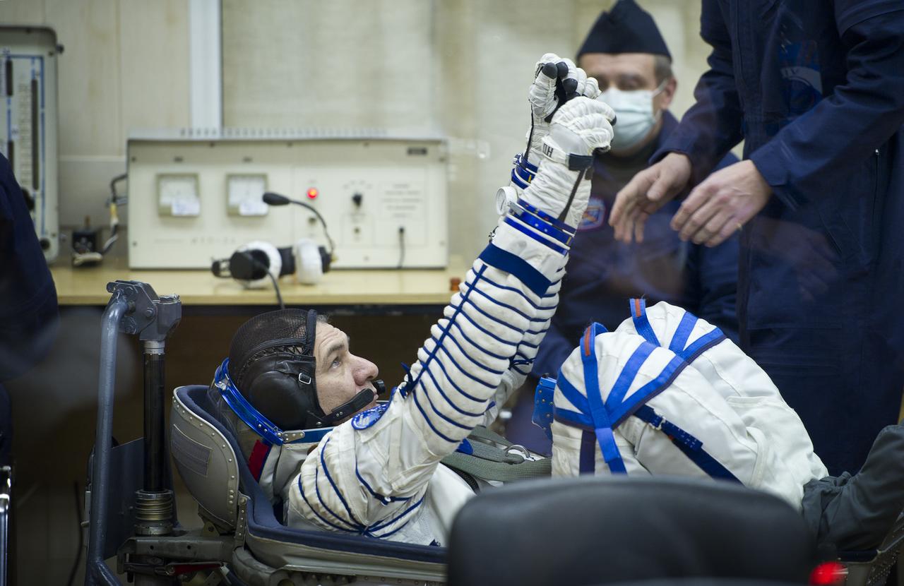 Expedition 26 European Space Agency astronaut Paolo Nespoli has his Russian Sokol suit pressure checked at the Baikonur Cosmodrome in Baikonur, Kazakhstan, Wednesday, Dec. 15, 2010. Nespoli and fellow Expedition 26 crew members Soyuz Commander Dmitry Kondratryev and NASA Flight Engineer Catherine Coleman launched in their Soyuz TMA-20 rocket from the Baikonur Cosmodrome in Kazakhstan the following morning at 1:09 a.m. local time. (Photo Credit: NASA/Carla Cioffi)