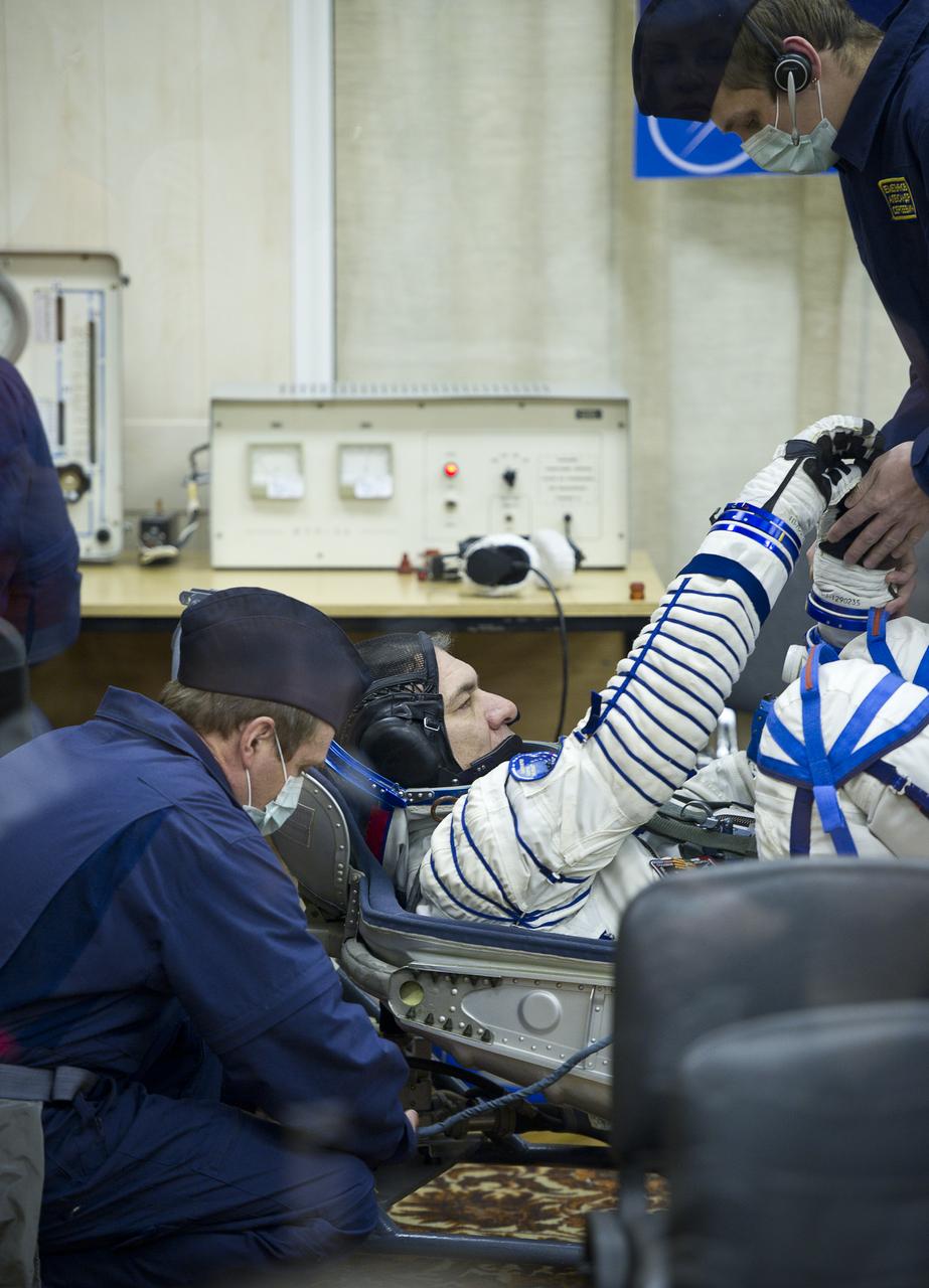 Expedition 26 European Space Agency astronaut Paolo Nespoli has his Russian Sokol suit pressure checked at the Baikonur Cosmodrome in Baikonur, Kazakhstan, Wednesday, Dec. 15, 2010. Nespoli and fellow Expedition 26 crew members Soyuz Commander Dmitry Kondratryev and NASA Flight Engineer Catherine Coleman launched in their Soyuz TMA-20 rocket from the Baikonur Cosmodrome in Kazakhstan the following morning at 1:09 a.m. local time. (Photo Credit: NASA/Carla Cioffi)
