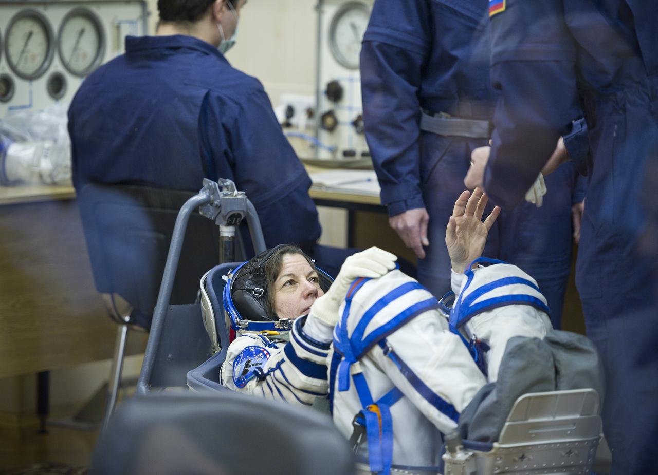 Expedition 26 NASA Flight Engineer Catherine Coleman has her Russian Sokol suit pressure checked prior to her launch at the Baikonur Cosmodrome Wednesday, Dec. 15, 2010 in Kazakhstan. Coleman and fellow Expedition 26 crew members Soyuz Commander Dmitry Kondratryev and ESA Flight Engineer Paolo Nespoli launched in their Soyuz TMA-20 rocket from the Baikonur Cosmodrome in Kazakhstan the following morning at 1:09 a.m. local time. (Photo Credit: (NASA/Carla Cioffi)