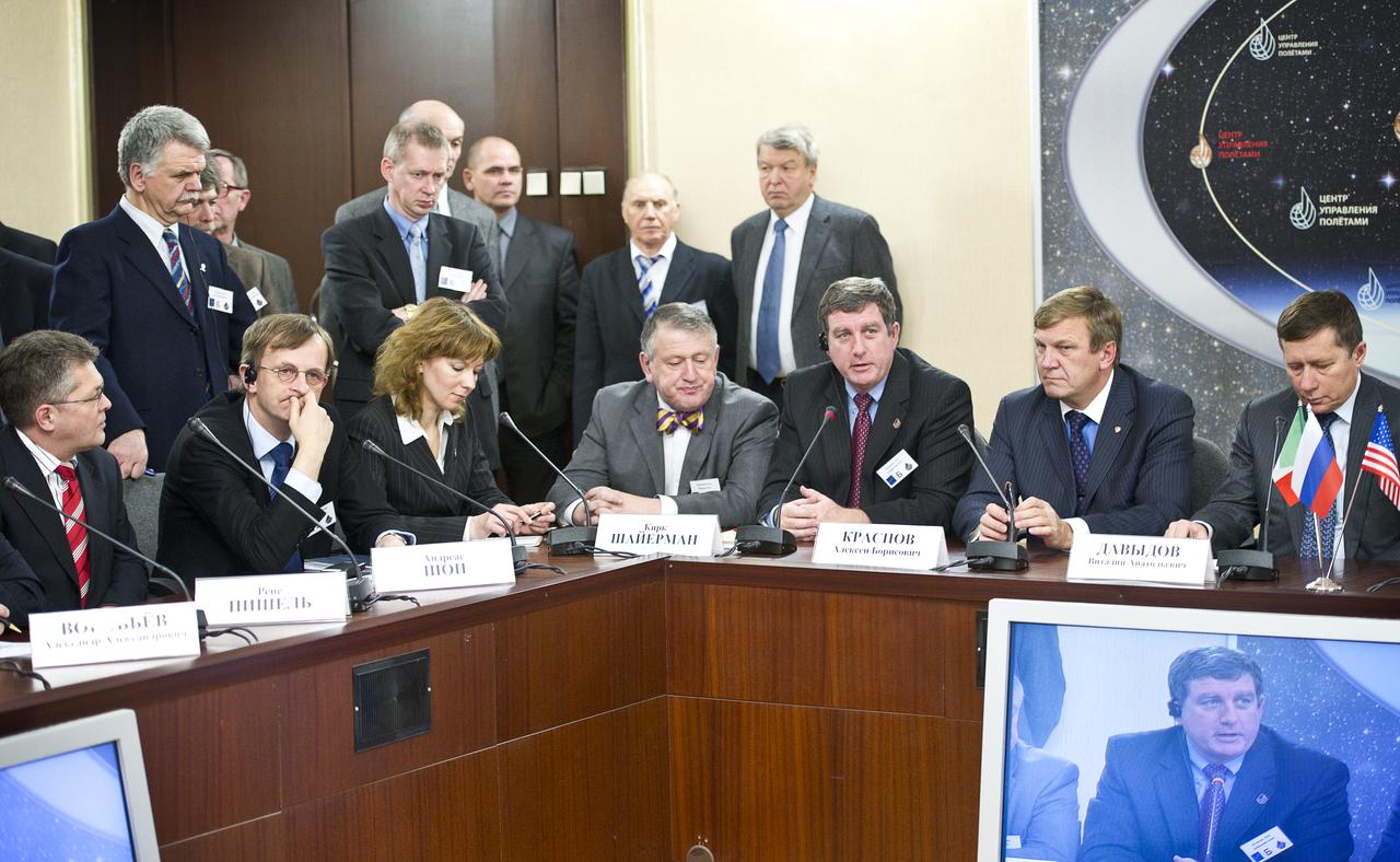 Kirk Shireman, third from right, NASA's deputy ISS program manager, answers reporter’s questions during a Soyuz post-docking press conference at the Russian Mission Control Center in Korolev, Russia on Saturday, Dec. 18, 2010. The Soyuz TMA-20 docked to the International Space Station carrying Expedition 26 Soyuz Commander Dmitry Kondratyev, Flight Engineer Catherine Coleman and European Space Agency Flight Engineer Paolo Nespoli. Photo Credit: (NASA/Carla Cioffi)