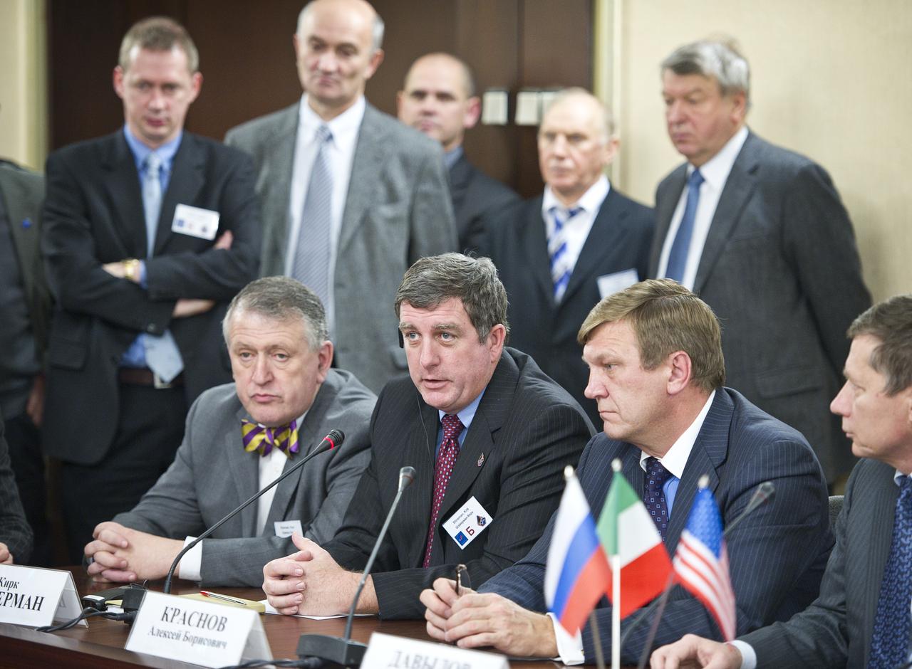 Kirk Shireman, third from right, NASA's deputy ISS program manager, answers reporter’s questions during a Soyuz post-docking press conference at the Russian Mission Control Center in Korolev, Russia on Saturday, Dec. 18, 2010. The Soyuz TMA-20 docked to the International Space Station carrying Expedition 26 Soyuz Commander Dmitry Kondratyev, Flight Engineer Catherine Coleman and European Space Agency Flight Engineer Paolo Nespoli. Photo Credit: (NASA/Carla Cioffi)