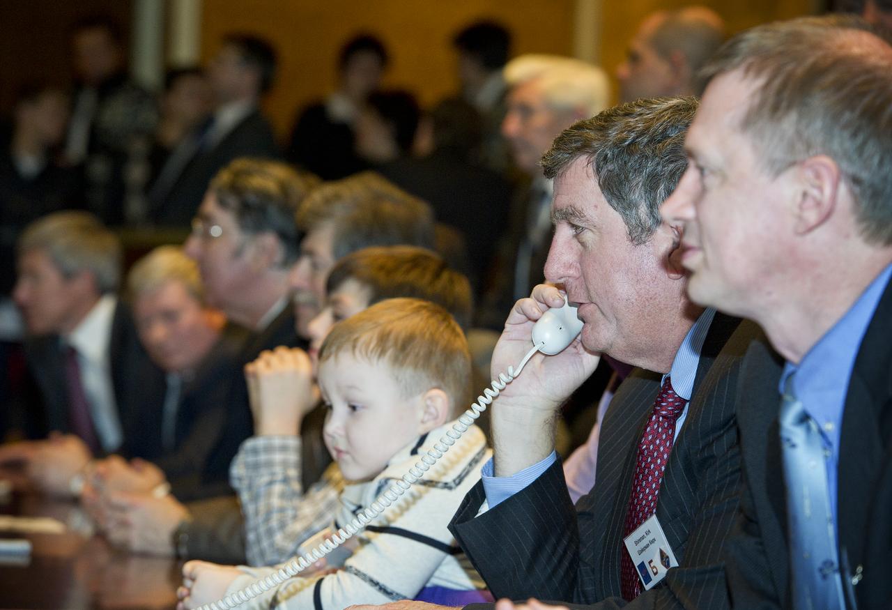Kirk Shireman, second from right, NASA's ISS Deputy Program Manager, is seen at Russian Mission Control in Korolev, Russia speaking to the crew of Expedition 26 shortly after their arrival at the International Space Station on Saturday, Dec. 18, 2010. Photo Credit: (NASA/Carla Cioffi)
