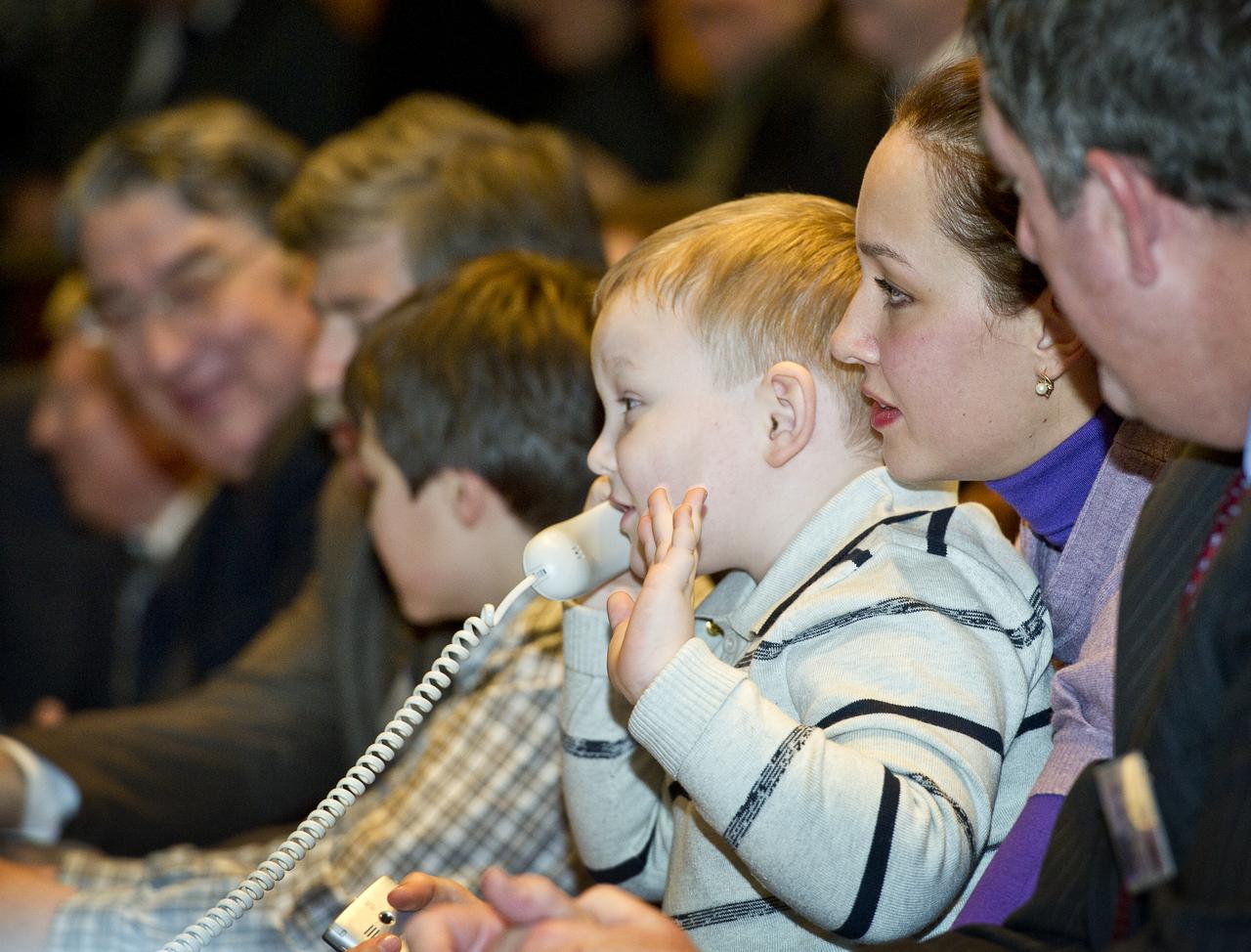 Vladislav Kondratyev, son of Expedition 26 Soyuz Commander Dmitry Kondratyev, is seen at Russian Mission Control in Korolev, Russia speaking to his father shortly after his arrival at the International Space Station on Saturday, Dec. 18, 2010. Photo Credit: (NASA/Carla Cioffi)