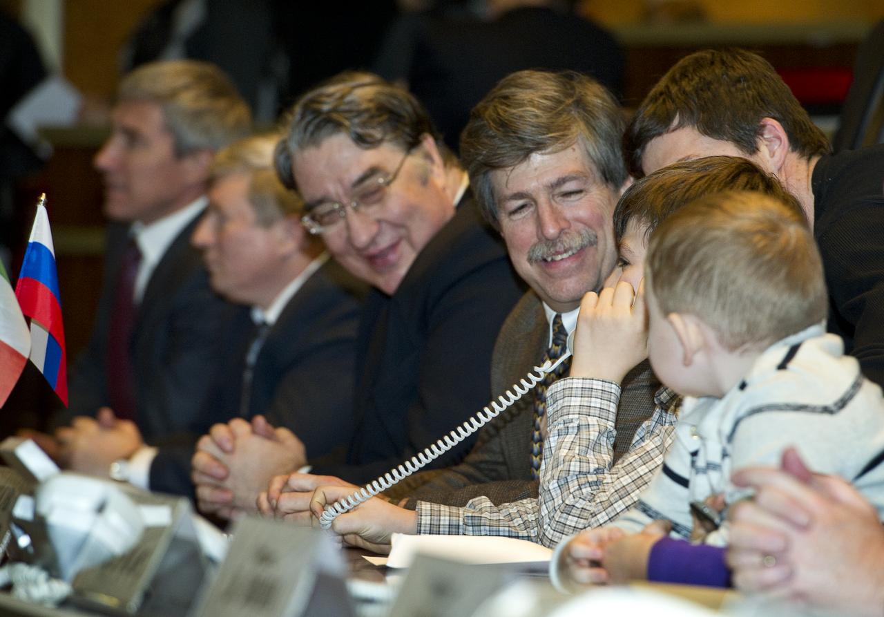 Jamey Simpson, son of Expedition 26 Flight Engineer Catherine Coleman, is seen at Russian Mission Control in Korolev, Russia speaking to his mother shortly after her arrival at the International Space Station on Saturday, Dec. 18, 2010. Photo Credit: (NASA/Carla Cioffi)