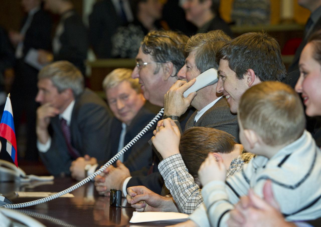 Josh Simpson, husband of Expedition 26 Flight Engineer Catherine Coleman, is seen at Russian Mission Control in Korolev, Russia speaking to his wife shortly after her arrival at the International Space Station on Saturday, Dec. 18, 2010. Photo Credit: (NASA/Carla Cioffi)
