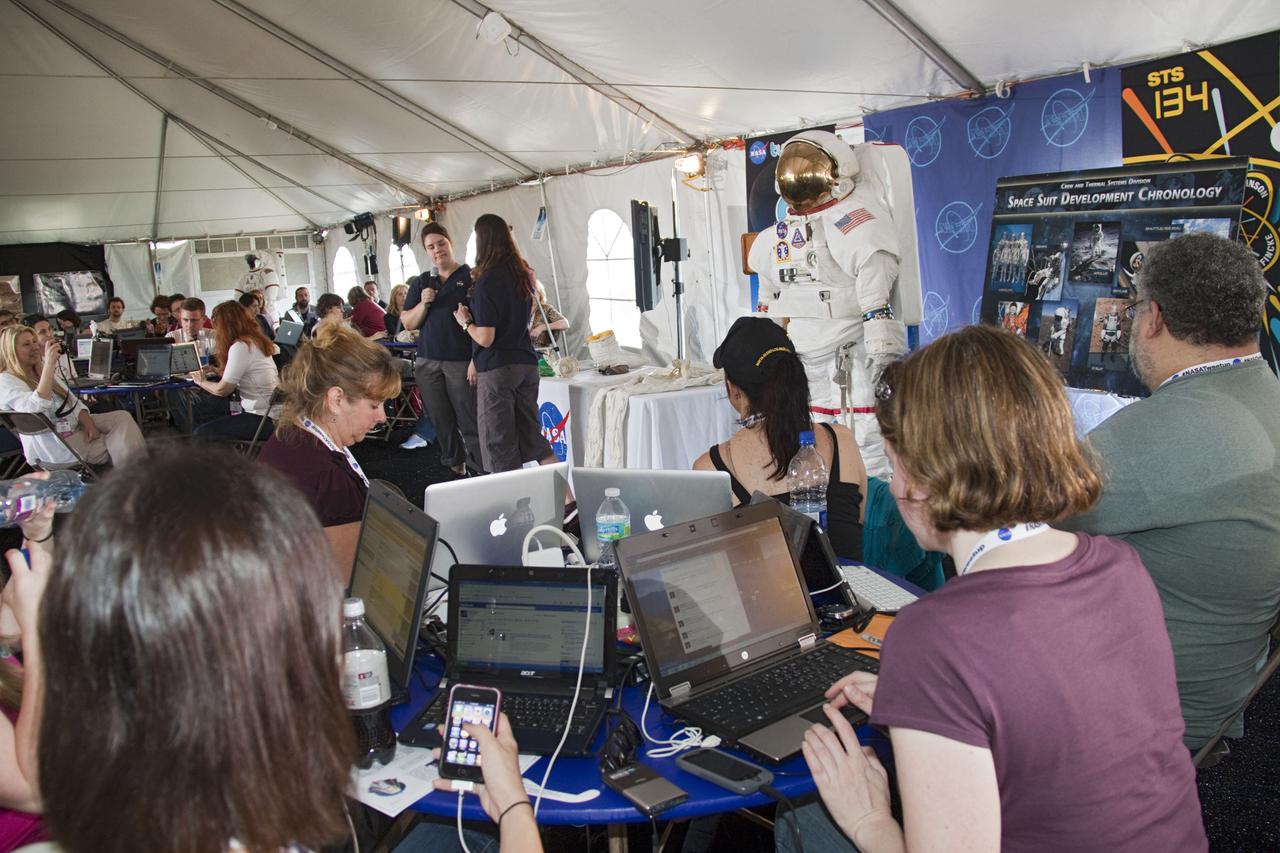 CAPE CANAVERAL, Fla. -- At NASA's Kennedy Space Center in Florida, Mallory Jennings and Heather Paul, aerospace engineers with Johnson Space Center's Spacesuit Life Support, perform a spacesuit demonstration during the STS-134 Tweetup event. About 150 people from 43 states, Washington, D.C., and half a dozen countries are participating in the event. A Tweetup gives followers of @NASA on the social messaging medium Twitter the opportunity to tour the center, view a shuttle launch and speak with NASA managers, astronauts, shuttle technicians and engineers. During the STS-134 mission, space shuttle Endeavour will deliver the Express Logistics Carrier-3, Alpha Magnetic Spectrometer-2 (AMS), a high-pressure gas tank and additional spare parts for the Dextre robotic helper to the International Space Station. Endeavour was scheduled to launch at 3:47 p.m. on April 29, but that attempt was scrubbed for at least 72 hours while engineers assess an issue associated with the shuttle's Auxiliary Power Unit 1. STS-134 will be the final spaceflight for Endeavour. For more information visit, www.nasa.gov_mission_pages_shuttle_shuttlemissions_sts134_index.html. Photo credit: NASA_Jack Pfaller