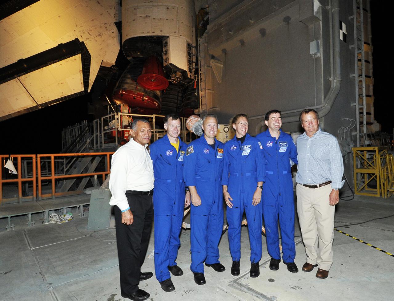 Kennedy Space Center Director Charley Bolden (L) The STS-135 crew (L-R) Commander Chris Ferguson, Pilot Doug Hurley and Mission Specialists Sandra Mangus,  Rex Walheim and Shuttle Launch Director Mike Leinbach pose for a photo  in front of Shuttle Atlantis on the Mobil Launch Platform (MLP) during it's final rollout to Launch Pad 39A at Kennedy Space Center, Cape Canaveral, Florida, USA 31 May 2011. Launch of Atlantis on the STS-135 mission to deliver supplies to the International Space Station is currently planned for no earlier than 08 July 2011. The STS-135 mission is  planned to last eight days and will be the final flight of the Space Shuttle program.