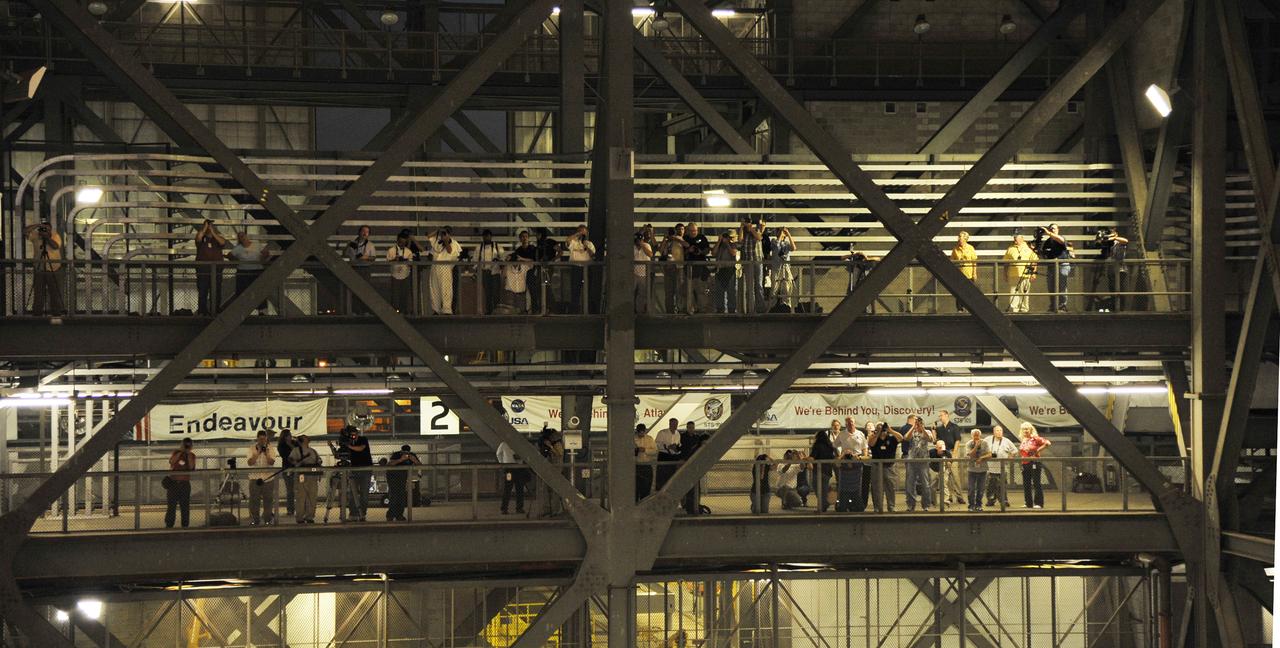 members of the media gather in the VAB to photograph the last rollout of Shuttle Atlantis on the Mobil Launch Platform (MLP)  at Kennedy Space Center, Cape Canaveral, Florida, USA 31 May 2011. Launch of Atlantis on the STS-135 mission to deliver supplies to the International Space Station is currently planned for no earlier than 08 July 2011. The STS-135 mission is  planned to last eight days and will be the final flight of the Space Shuttle program.