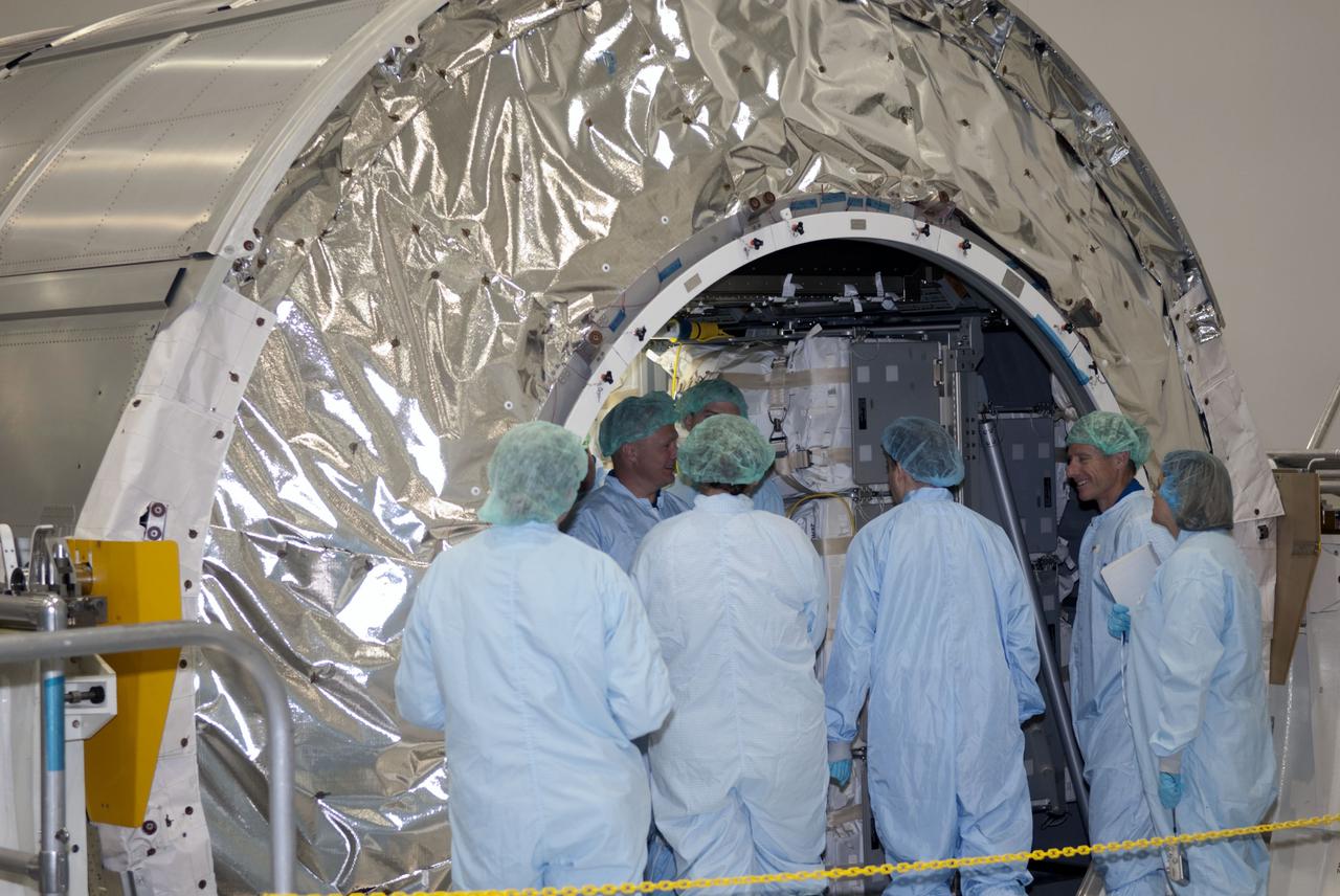 CAPE CANAVERAL, Fla. -- Space shuttle Atlantis' STS-135 crew participates in a crew equipment interface test, or CEIT, in the Space Station Processing Facility at NASA's Kennedy Space Center in Florida. Standing in front of the Raffaello multi-purpose logistics module, which will be packed with supplies, logistics and spare parts for their mission to the International Space Station, are,  Pilot Doug Hurley (in profile left), and Commander Chris Ferguson (in profile right).    The purpose of CEIT is for flight crew members to become familiar with the payload they will be working with and delivering to the station. STS-135 also will return a failed ammonia pump module on the Lightweight Multi-Purpose Experiment Support Structure Carrier, or LMC, to help NASA better understand the failure mechanism and improve pump designs for future systems. STS-135, targeted to launch June 28, will be the 33rd flight of Atlantis, the 37th shuttle mission to the space station, and the 135th and final mission of NASA's Space Shuttle Program. For more information visit, www.nasa.gov_mission_pages_shuttle_shuttlemissions_sts135_index.html. Photo credit: NASA_Jim Grossmann