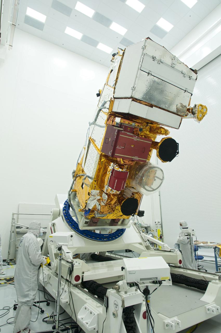 BALL AEROSPACE, Boulder, Colo. – In a cleanroom at Ball Aerospace and Technologies Corp., technicians inspect NASA's National Polar-orbiting Operational Environmental Satellite System Preparatory Project NPP satellite following electromagnetic compatibility testing. A United Launch Alliance Delta II rocket will carry NPP into space.  NPP represents a critical first step in building the next-generation of Earth-observing satellites. NPP will carry the first of the new sensors developed for this satellite fleet, now known as the Joint Polar Satellite System JPSS to be launched in 2016. NPP is the bridge between NASA's Earth Observing System EOS satellites and the forthcoming series of JPSS satellites. The mission will test key technologies and instruments for the JPSS missions. NPP is targeted to launch Oct. 27. For more information, visit http:__www.nasa.gov_NPP. Photo credit: Ball Aerospace