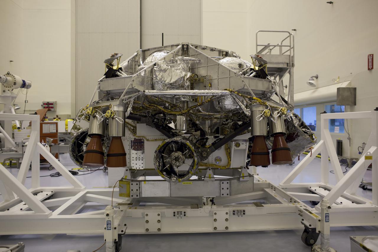 CAPE CANAVERAL, Fla. – In the Payload Hazardous Servicing Facility at NASA's Kennedy Space Center in Florida, the Mars Science Laboratory (MSL) rover, Curiosity, awaits encapsulation inside a backshell. The spacecraft's backshell, a protective cover, carries the parachute and several components used during later stages of entry, descent and landing of the MSL's rover. The rover has been integrated with a rocket-powered descent stage which will lower Curiosity to the surface of Mars. A United Launch Alliance Atlas V-541 configuration will be used to loft MSL into space. MSL's components include a compact car-sized rover, Curiosity, which has 10 science instruments designed to search for evidence on whether Mars has had environments favorable to microbial life, including chemical ingredients for life. The unique rover will use a laser to look inside rocks and release its gasses so that the rover’s spectrometer can analyze and send the data back to Earth. MSL is scheduled to launch Nov. 25 with a window extending to Dec. 18 and arrival at Mars Aug. 2012. For more information, visit http:__www.nasa.gov_msl. Photo credit: NASA_Dimitri Gerondidakis