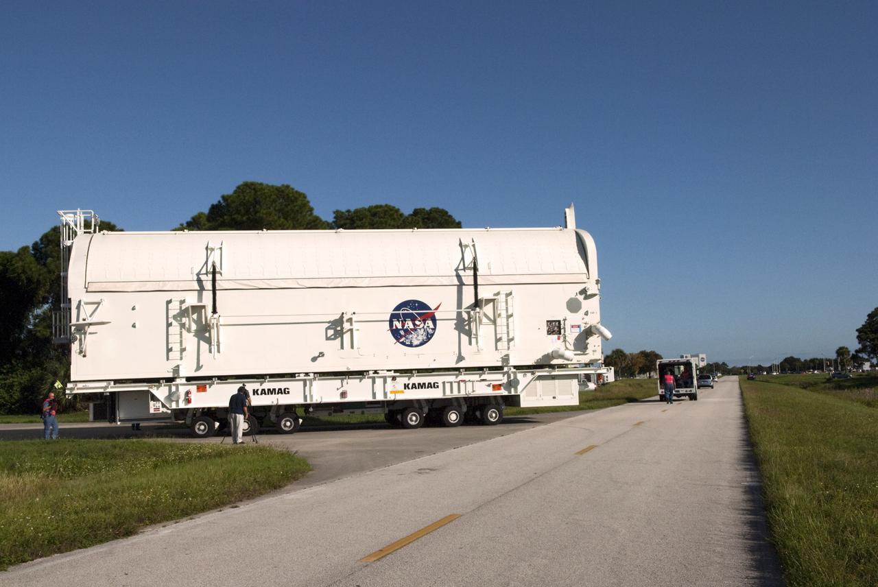 CAPE CANAVERAL, Fla. -- At NASA's Kennedy Space Center in Florida, payload canister #1 winds its way along the roads from the Canister Rotation Facility to the Reutilization, Recycling and Marketing Facility on Ransom Road.   The two payload canisters used to transport space shuttle payloads to the launch pad for installation in the shuttles' cargo bays are being decommissioned following the end of the Space Shuttle Program. Each canister weighs 110,000 pounds and is 65 feet long, 22 feet wide, and 18 feet, 7 inches high.  The canisters were prescreened through NASA Headquarters as possible artifacts, but their size makes them difficult to transport to locations off the center. Federal and state agencies now will be given the opportunity to screen the canisters for potential use before a final decision is made on their disposition.  For more information, visit http:__www.nasa.gov_centers_kennedy_pdf_167403main_CRF-06.pdf. Photo credit: NASA_Jim Grossmann