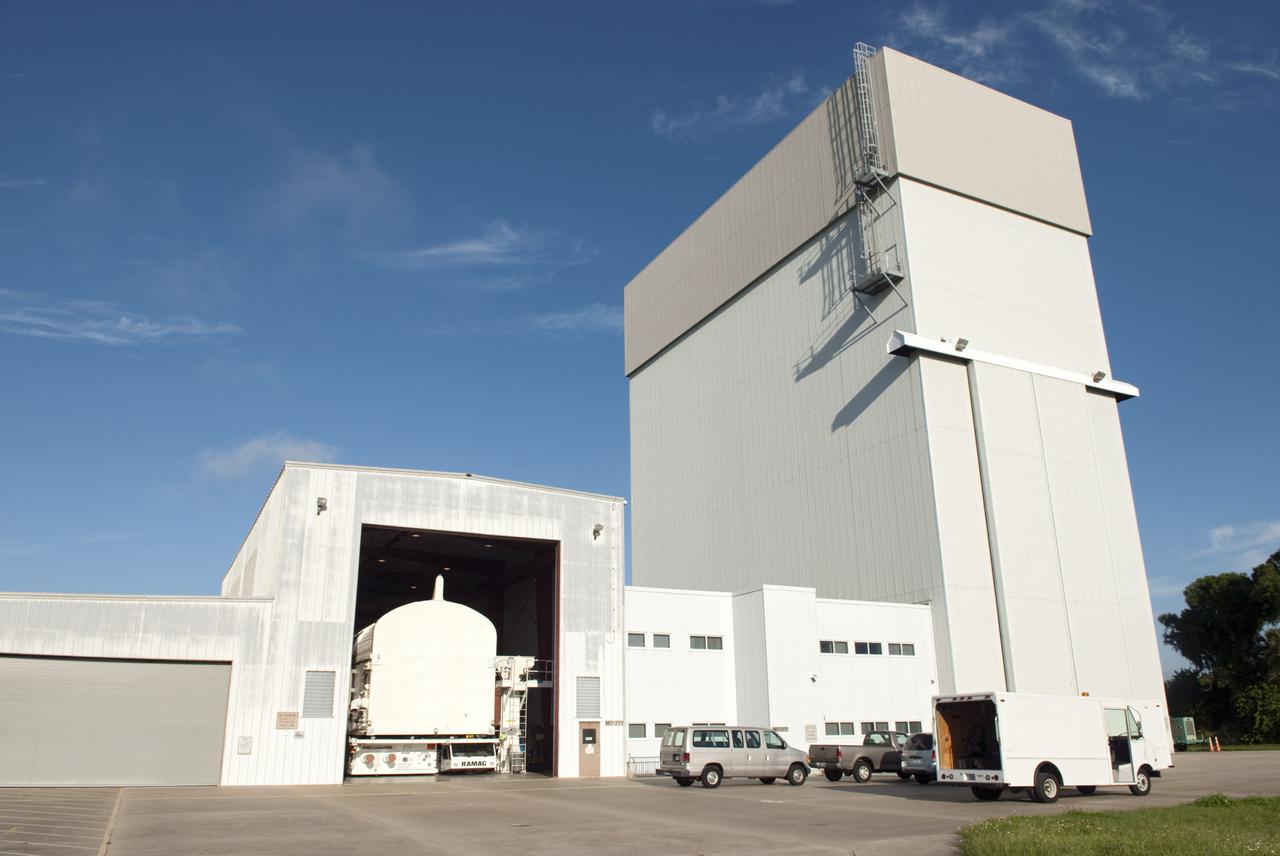 CAPE CANAVERAL, Fla. -- At the Canister Rotation Facility at NASA's Kennedy Space Center in Florida, preparations are under way to move payload canister #2 to the Reutilization, Recycling and Marketing Facility on Ransom Road.  The two payload canisters used to transport space shuttle payloads to the launch pad for installation in the shuttles' cargo bays are being decommissioned following the end of the Space Shuttle Program. Each canister weighs 110,000 pounds and is 65 feet long, 22 feet wide, and 18 feet, 7 inches high.  The canisters were prescreened through NASA Headquarters as possible artifacts, but their size makes them difficult to transport to locations off the center. Federal and state agencies now will be given the opportunity to screen the canisters for potential use before a final decision is made on their disposition.  For more information, visit http:__www.nasa.gov_centers_kennedy_pdf_167403main_CRF-06.pdf. Photo credit: NASA_Jim Grossmann