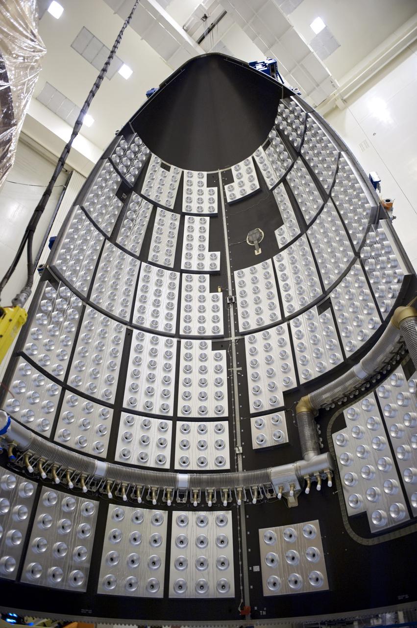 CAPE CANAVERAL, Fla. -- In the Payload Hazardous Servicing Facility at NASA's Kennedy Space Center in Florida, half of the Atlas V payload fairing for NASA's Mars Science Laboratory (MSL) mission hangs vertically from the ceiling. The interior of the fairing is lined with the fairing acoustic protection (FAP) system which protects the payload by dampening the sound created by the rocket during liftoff. As a precaution, the fairing next will be cleaned to meet NASA's planetary protection requirements. The fairing will protect the spacecraft from the impact of aerodynamic pressure and heating during ascent. Although jettisoned once the spacecraft is outside the Earth's atmosphere, the fairing must be cleaned to the same exacting standards as the laboratory to avoid the possibility of contaminating it. MSL's components include a compact car-sized rover, Curiosity, which has 10 science instruments designed to search for evidence on whether Mars has had environments favorable to microbial life, including the chemical ingredients for life. The unique rover will use a laser to look inside rocks and release its gasses so that the rover’s spectrometer can analyze and send the data back to Earth. Launch of MSL aboard a United Launch Alliance Atlas V rocket is planned for Nov. 25 from Space Launch Complex 41 on Cape Canaveral Air Force Station. For more information, visit http:__www.nasa.gov_msl. Photo credit: NASA_Kim Shiflett