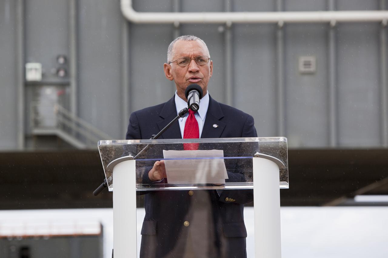 CAPE CANAVERAL, Fla. – At Kennedy Space Center in Florida, NASA Administrator Charlie Bolden talks to media in front of NASA’s mobile launcher (ML) support structure. Center Director Bob Cabana also attended the media event held to detail ML’s use with NASA’s Space Launch System (SLS) heavy-lift rocket, which will take astronauts into deep space on missions to asteroids, the moon or Mars.    It took about two years to construct the 355-foot-tall ML structure, which will support NASA's future human spaceflight program. The ML can be outfitted with ground support equipment, such as umbilicals and access arms, for future rocket launches. Photo credit: NASA_Dimitri Gerondidakis