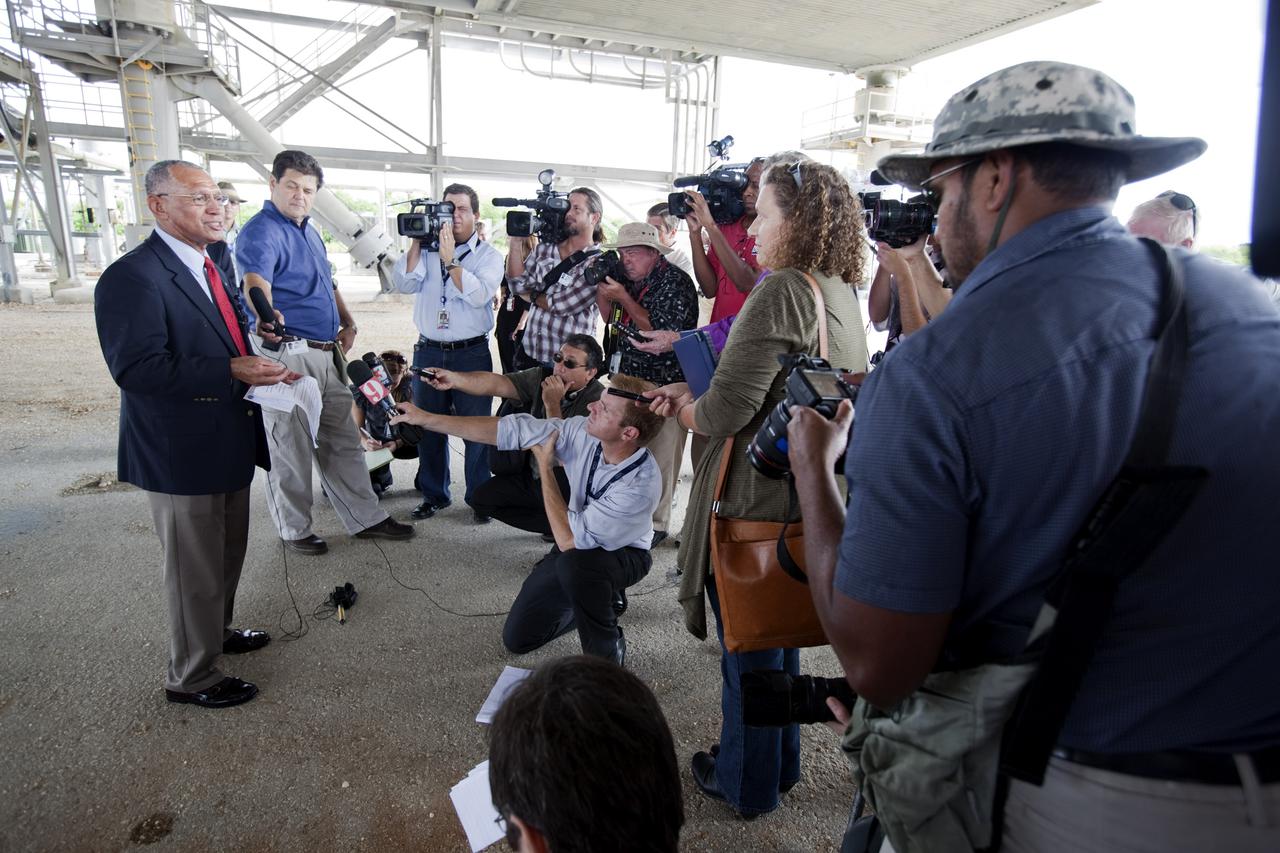CAPE CANAVERAL, Fla. – At Kennedy Space Center in Florida, NASA Administrator Charlie Bolden talks to media underneath NASA’s mobile launcher (ML) support structure. Center Director Bob Cabana also attended the media event held to detail ML’s use with NASA’s Space Launch System (SLS) heavy-lift rocket, which will take astronauts into deep space on missions to asteroids, the moon or Mars.    It took about two years to construct the 355-foot-tall ML structure, which will support NASA's future human spaceflight program. The ML can be outfitted with ground support equipment, such as umbilicals and access arms, for future rocket launches. Photo credit: NASA_Dimitri Gerondidakis