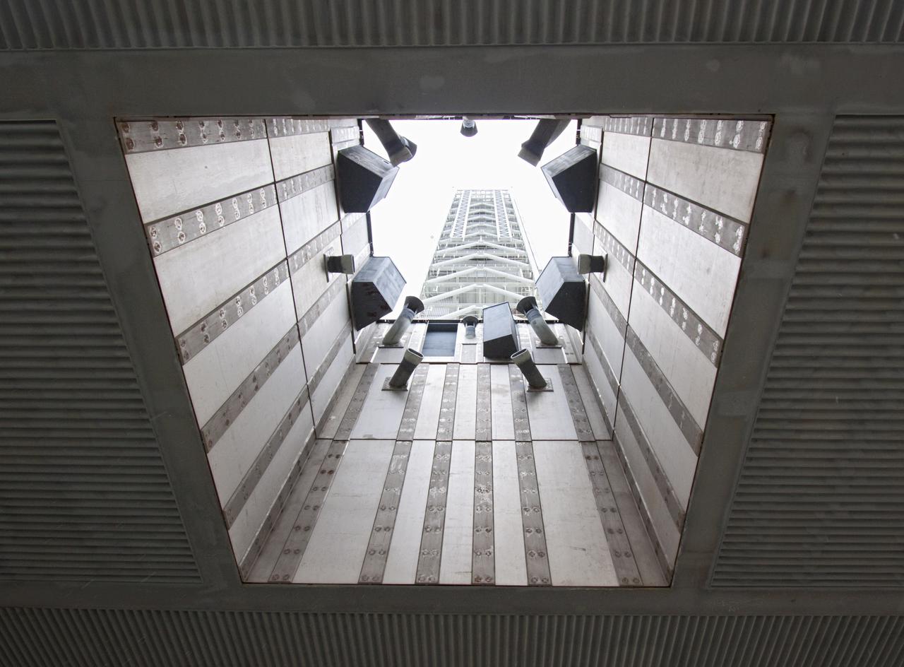 CAPE CANAVERAL, Fla. – The camera captures a unique view looking up into NASA’s mobile launcher (ML) support structure at Kennedy Space Center in Florida. A media event was held on the grounds to detail ML’s use with NASA’s Space Launch System (SLS) heavy-lift rocket, which will take astronauts into deep space on missions to asteroids, the moon or Mars. NASA Administrator Charlie Bolden and Center Director Bob Cabana also were in attendance for the event.   It took about two years to construct the 355-foot-tall ML structure, which will support NASA's future human spaceflight program. The ML can be outfitted with ground support equipment, such as umbilicals and access arms, for future rocket launches. Photo credit: NASA_Jim Grossmann