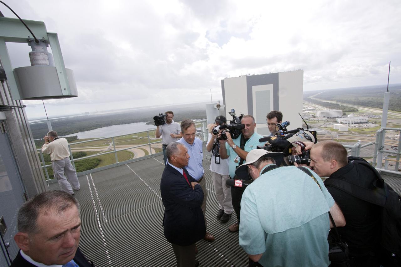 CAPE CANAVERAL, Fla. – At Kennedy Space Center in Florida, NASA Administrator Charlie Bolden talks to media on top of NASA’s mobile launcher (ML) support structure. Center Director Bob Cabana also attended the media event held to detail ML’s use with NASA’s Space Launch System (SLS) heavy-lift rocket, which will take astronauts into deep space on missions to asteroids, the moon or Mars.    It took about two years to construct the 355-foot-tall ML structure, which will support NASA's future human spaceflight program. The ML can be outfitted with ground support equipment, such as umbilicals and access arms, for future rocket launches. Photo credit: NASA_Jim Grossmann