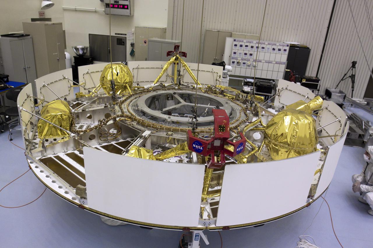 CAPE CANAVERAL, Fla. – In the Payload Hazardous Servicing Facility at NASA’s Kennedy Space Center in Florida, an overhead crane has been attached to NASA's Mars Science Laboratory (MSL) mission cruise stage. The cruise stage, which will be lifted onto a rotation stand, provides solar power, thrusters for navigation, and heat exchangers to the rover during its flight from Earth to Mars. MSL's components include a car-sized rover, Curiosity, which has 10 science instruments designed to search for evidence on whether Mars has had environments favorable to microbial life, including chemical ingredients for life. The unique rover will use a laser to look inside rocks and release its gasses so that the rover’s spectrometer can analyze and send the data back to Earth. Launch of MSL aboard a United Launch Alliance Atlas V rocket is scheduled for Nov. 25 from Space Launch Complex 41 on Cape Canaveral Air Force Station in Florida. For more information, visit http:__www.nasa.gov_msl. Photo credit: NASA_Glenn Benson
