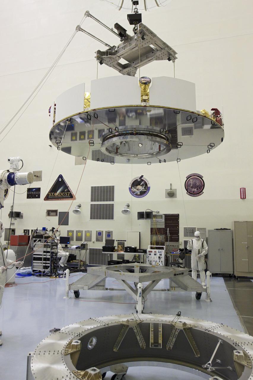 CAPE CANAVERAL, Fla. – In the Payload Hazardous Servicing Facility at NASA’s Kennedy Space Center in Florida, technicians, using an overhead crane, lift NASA's Mars Science Laboratory (MSL) mission cruise stage for placement onto a rotation stand. The cruise stage provides solar power, thrusters for navigation, and heat exchangers to the rover during its flight from Earth to Mars.    MSL's components include a car-sized rover, Curiosity, which has 10 science instruments designed to search for evidence on whether Mars has had environments favorable to microbial life, including chemical ingredients for life.  The unique rover will use a laser to look inside rocks and release its gasses so that the rover’s spectrometer can analyze and send the data back to Earth. Launch of MSL aboard a United Launch Alliance Atlas V rocket is scheduled for Nov. 25 from Space Launch Complex 41 on Cape Canaveral Air Force Station in Florida. For more information, visit http:__www.nasa.gov_msl. Photo credit: NASA_Glenn Benson