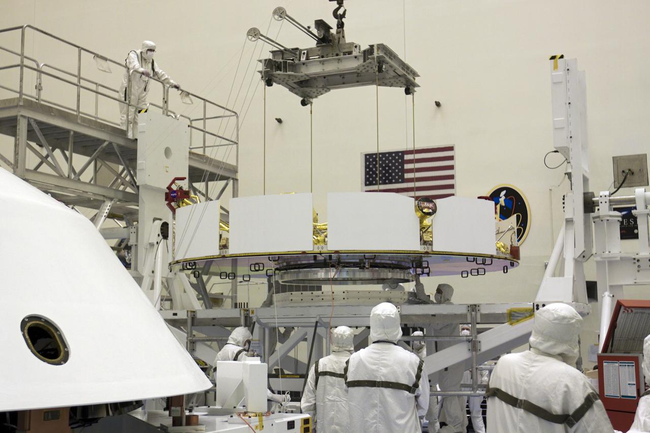 CAPE CANAVERAL, Fla. – In the Payload Hazardous Servicing Facility at NASA’s Kennedy Space Center in Florida, technicians inspect NASA's Mars Science Laboratory (MSL) mission cruise stage as it is guided onto a rotation stand. The cruise stage provides solar power, thrusters for navigation, and heat exchangers to the rover during its flight from Earth to Mars.   MSL's components include a car-sized rover, Curiosity, which has 10 science instruments designed to search for evidence on whether Mars has had environments favorable to microbial life, including chemical ingredients for life.  The unique rover will use a laser to look inside rocks and release its gasses so that the rover’s spectrometer can analyze and send the data back to Earth. Launch of MSL aboard a United Launch Alliance Atlas V rocket is scheduled for Nov. 25 from Space Launch Complex 41 on Cape Canaveral Air Force Station in Florida. For more information, visit http:__www.nasa.gov_msl. Photo credit: NASA_Glenn Benson