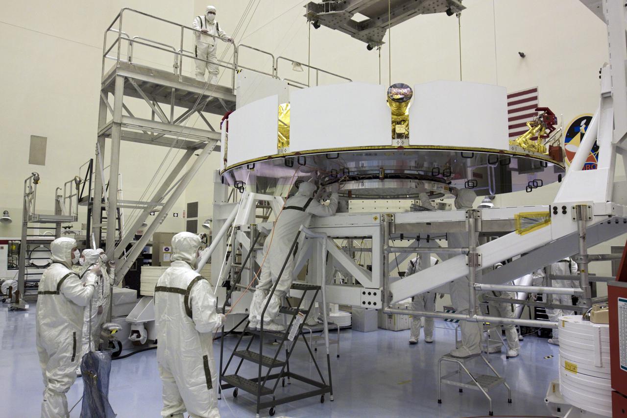 CAPE CANAVERAL, Fla. – In the Payload Hazardous Servicing Facility at NASA’s Kennedy Space Center in Florida, technicians inspect NASA's Mars Science Laboratory (MSL) mission cruise stage as it is guided onto a rotation stand. The cruise stage provides solar power, thrusters for navigation, and heat exchangers to the rover during its flight from Earth to Mars. MSL's components include a car-sized rover, Curiosity, which has 10 science instruments designed to search for evidence on whether Mars has had environments favorable to microbial life, including chemical ingredients for life. The unique rover will use a laser to look inside rocks and release its gasses so that the rover’s spectrometer can analyze and send the data back to Earth. Launch of MSL aboard a United Launch Alliance Atlas V rocket is scheduled for Nov. 25 from Space Launch Complex 41 on Cape Canaveral Air Force Station in Florida. For more information, visit http:__www.nasa.gov_msl. Photo credit: NASA_Glenn Benson