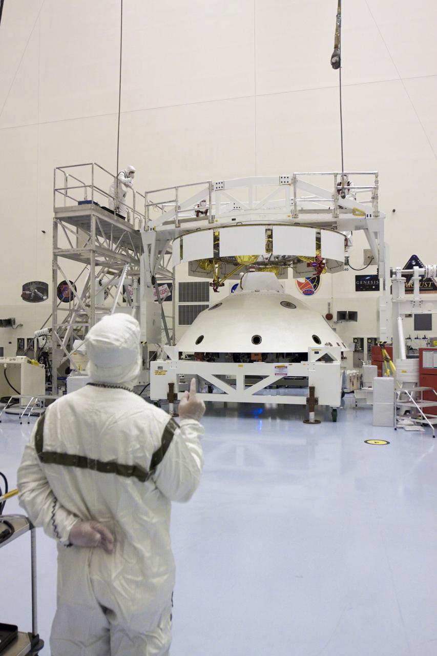 CAPE CANAVERAL, Fla. – In the Payload Hazardous Servicing Facility at NASA’s Kennedy Space Center in Florida, technicians begin the process of mating NASA's Mars Science Laboratory (MSL) mission cruise stage to the aeroshell, which contains the compact car-sized rover Curiosity. The cruise stage provides solar power, thrusters for navigation, and heat exchangers to the rover during its flight from Earth to Mars.  The rover Curiosity has 10 science instruments designed to search for evidence on whether Mars has had environments favorable to microbial life, including chemical ingredients for life.  The unique rover will use a laser to look inside rocks and release its gasses so that the rover’s spectrometer can analyze and send the data back to Earth. Launch of MSL aboard a United Launch Alliance Atlas V rocket is scheduled for Nov. 25 from Space Launch Complex 41 on Cape Canaveral Air Force Station in Florida. For more information, visit http:__www.nasa.gov_msl. Photo credit: NASA_Glenn Benson