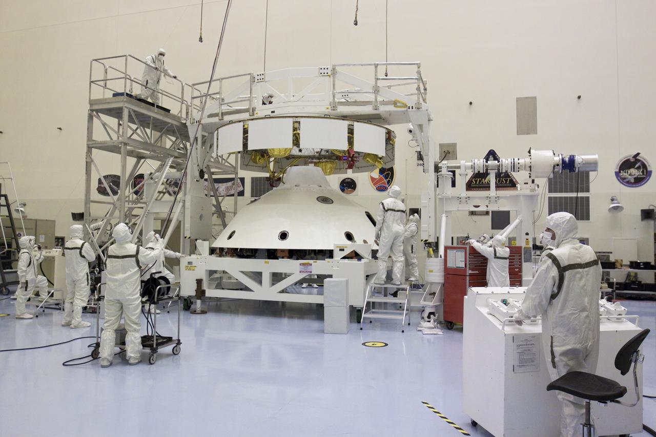 CAPE CANAVERAL, Fla. – In the Payload Hazardous Servicing Facility at NASA’s Kennedy Space Center in Florida, technicians prepare to attach an overhead crane to NASA's Mars Science Laboratory (MSL) mission aeroshell, (containing the compact car-sized rover Curiosity), which will be mated to the cruise stage. The cruise stage provides solar power, thrusters for navigation, and heat exchangers to the rover during its flight from Earth to Mars.   The rover Curiosity has 10 science instruments designed to search for evidence on whether Mars has had environments favorable to microbial life, including chemical ingredients for life.  The unique rover will use a laser to look inside rocks and release its gasses so that the rover’s spectrometer can analyze and send the data back to Earth. Launch of MSL aboard a United Launch Alliance Atlas V rocket is scheduled for Nov. 25 from Space Launch Complex 41 on Cape Canaveral Air Force Station in Florida. For more information, visit http:__www.nasa.gov_msl. Photo credit: NASA_Glenn Benson