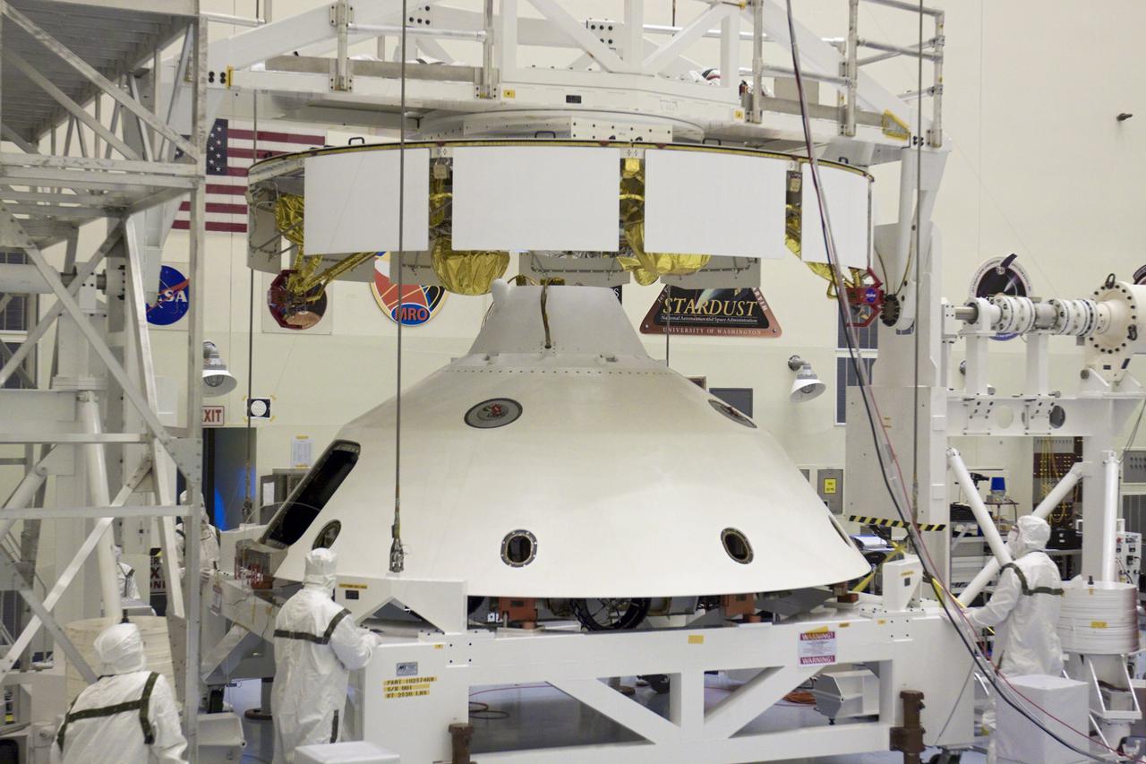 CAPE CANAVERAL, Fla. – In the Payload Hazardous Servicing Facility at NASA’s Kennedy Space Center in Florida, technicians, using an overhead crane, lift NASA's Mars Science Laboratory (MSL) mission aeroshell, (containing the compact car-sized rover Curiosity), for mating to the cruise stage. The cruise stage provides solar power, thrusters for navigation, and heat exchangers to the rover during its flight from Earth to Mars.   The rover Curiosity has 10 science instruments designed to search for evidence on whether Mars has had environments favorable to microbial life, including chemical ingredients for life.  The unique rover will use a laser to look inside rocks and release its gasses so that the rover’s spectrometer can analyze and send the data back to Earth. Launch of MSL aboard a United Launch Alliance Atlas V rocket is scheduled for Nov. 25 from Space Launch Complex 41 on Cape Canaveral Air Force Station in Florida. For more information, visit http:__www.nasa.gov_msl. Photo credit: NASA_Glenn Benson