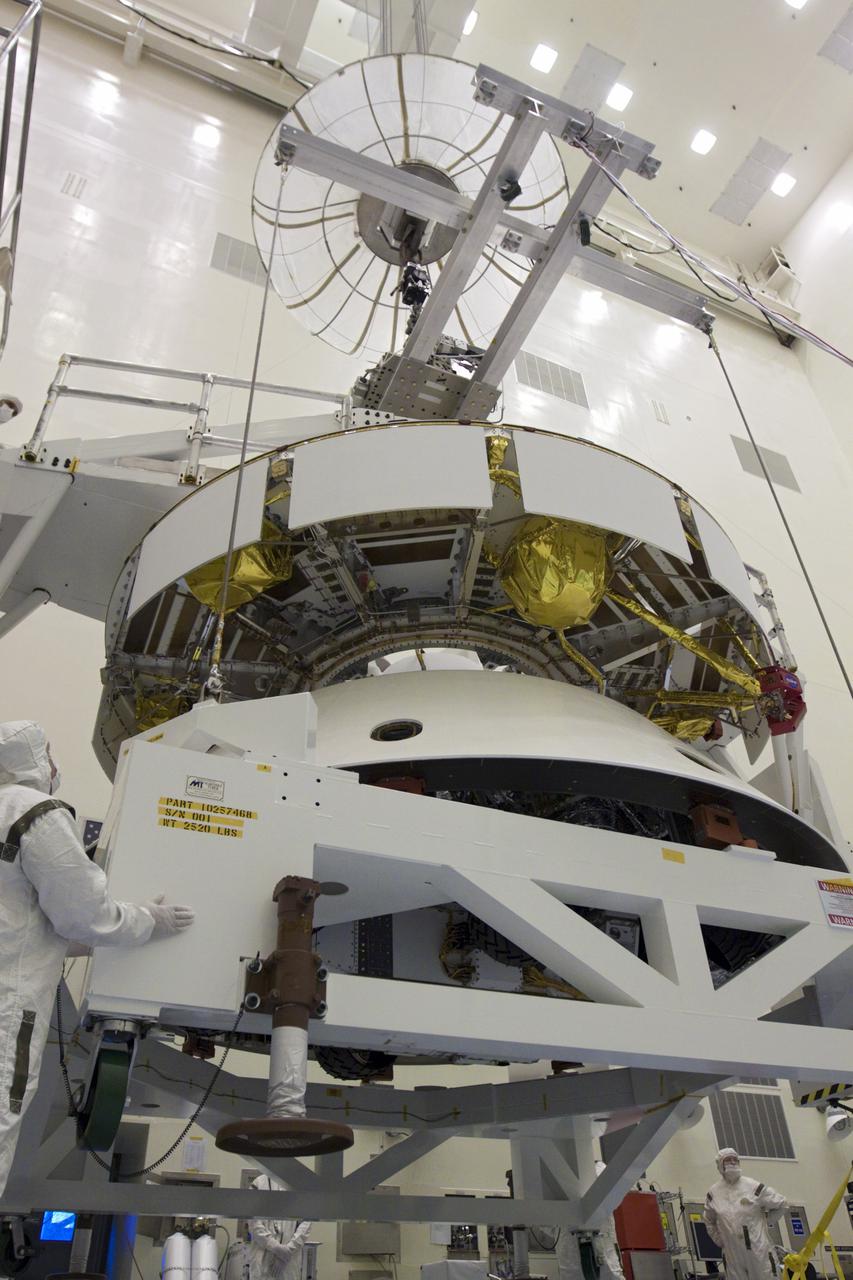CAPE CANAVERAL, Fla. – In the Payload Hazardous Servicing Facility at NASA’s Kennedy Space Center in Florida, technicians, using an overhead crane, lift NASA's Mars Science Laboratory (MSL) mission aeroshell, (containing the compact car-sized rover Curiosity), for mating to the cruise stage. The cruise stage provides solar power, thrusters for navigation, and heat exchangers to the rover during its flight from Earth to Mars. The rover Curiosity has 10 science instruments designed to search for evidence on whether Mars has had environments favorable to microbial life, including chemical ingredients for life. The unique rover will use a laser to look inside rocks and release its gasses so that the rover’s spectrometer can analyze and send the data back to Earth. Launch of MSL aboard a United Launch Alliance Atlas V rocket is scheduled for Nov. 25 from Space Launch Complex 41 on Cape Canaveral Air Force Station in Florida. For more information, visit http:__www.nasa.gov_msl. Photo credit: NASA_Glenn Benson