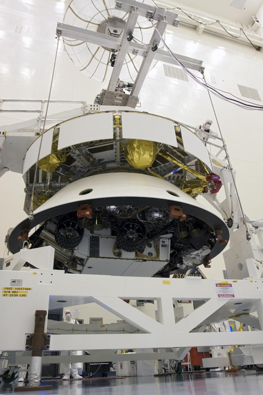 CAPE CANAVERAL, Fla. – In the Payload Hazardous Servicing Facility at NASA’s Kennedy Space Center in Florida, technicians, using an overhead crane, lift NASA's Mars Science Laboratory (MSL) mission aeroshell, (containing the compact car-sized rover Curiosity), for mating to the cruise stage. The cruise stage provides solar power, thrusters for navigation, and heat exchangers to the rover during its flight from Earth to Mars.   The rover Curiosity has 10 science instruments designed to search for evidence on whether Mars has had environments favorable to microbial life, including chemical ingredients for life.  The unique rover will use a laser to look inside rocks and release its gasses so that the rover’s spectrometer can analyze and send the data back to Earth. Launch of MSL aboard a United Launch Alliance Atlas V rocket is scheduled for Nov. 25 from Space Launch Complex 41 on Cape Canaveral Air Force Station in Florida. For more information, visit http:__www.nasa.gov_msl. Photo credit: NASA_Glenn Benson