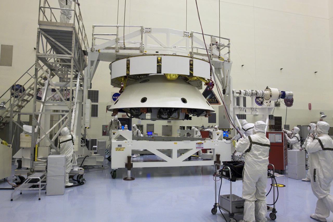 CAPE CANAVERAL, Fla. – In the Payload Hazardous Servicing Facility at NASA’s Kennedy Space Center in Florida, technicians, using an overhead crane, lift NASA's Mars Science Laboratory (MSL) mission aeroshell, (containing the compact car-sized rover Curiosity), for mating to the cruise stage. The cruise stage provides solar power, thrusters for navigation, and heat exchangers to the rover during its flight from Earth to Mars. The rover Curiosity has 10 science instruments designed to search for evidence on whether Mars has had environments favorable to microbial life, including chemical ingredients for life. The unique rover will use a laser to look inside rocks and release its gasses so that the rover’s spectrometer can analyze and send the data back to Earth. Launch of MSL aboard a United Launch Alliance Atlas V rocket is scheduled for Nov. 25 from Space Launch Complex 41 on Cape Canaveral Air Force Station in Florida. For more information, visit http:__www.nasa.gov_msl. Photo credit: NASA_Glenn Benson