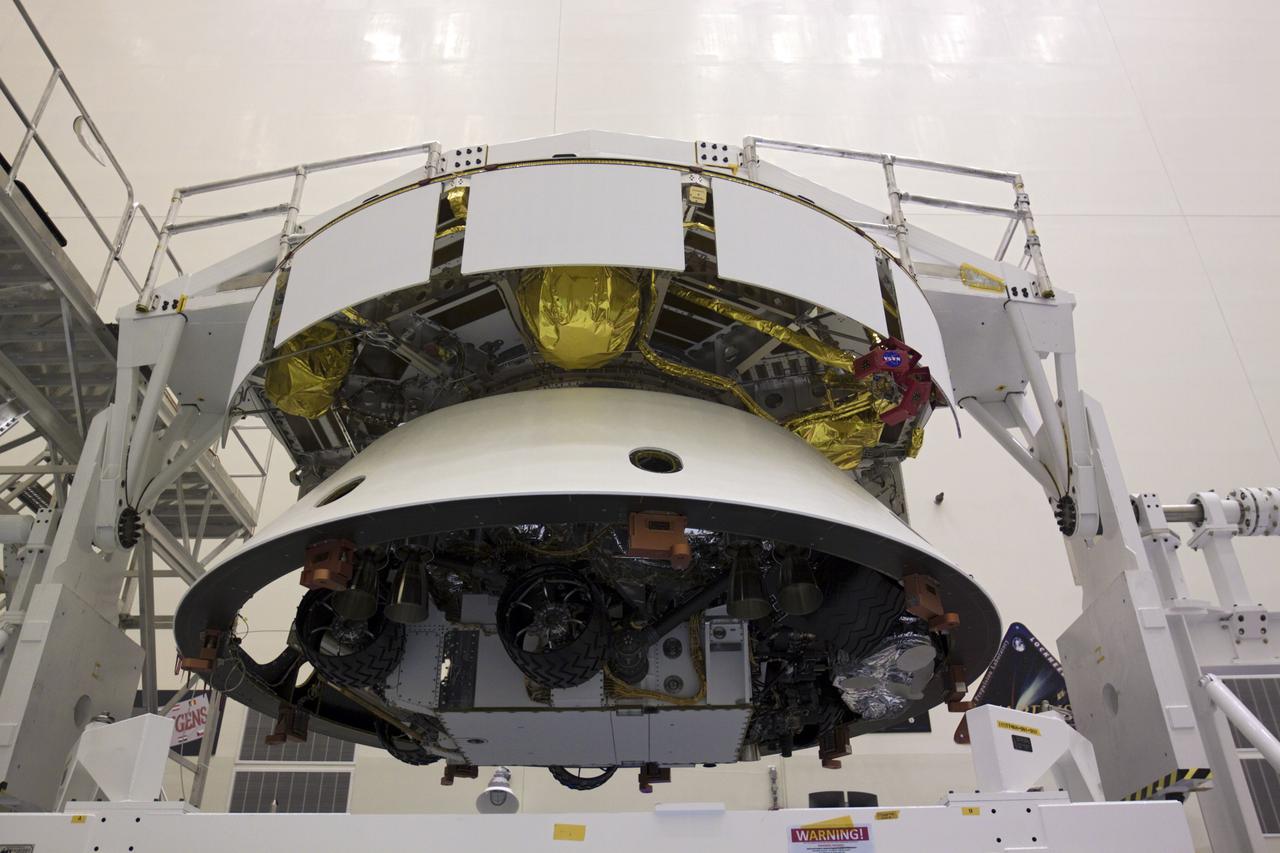 CAPE CANAVERAL, Fla. – In the Payload Hazardous Servicing Facility at NASA’s Kennedy Space Center in Florida, NASA's Mars Science Laboratory (MSL) mission aeroshell, (containing the compact car-sized rover Curiosity), has been mated to the cruise stage. The cruise stage provides solar power, thrusters for navigation, and heat exchangers to the rover during its flight from Earth to Mars. The rover Curiosity has 10 science instruments designed to search for evidence on whether Mars has had environments favorable to microbial life, including chemical ingredients for life. The unique rover will use a laser to look inside rocks and release its gasses so that the rover’s spectrometer can analyze and send the data back to Earth. Launch of MSL aboard a United Launch Alliance Atlas V rocket is scheduled for Nov. 25 from Space Launch Complex 41 on Cape Canaveral Air Force Station in Florida. For more information, visit http:__www.nasa.gov_msl. Photo credit: NASA_Glenn Benson